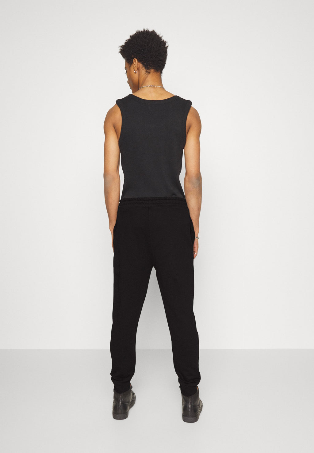 DUTSCHI - Tracksuit bottoms - black