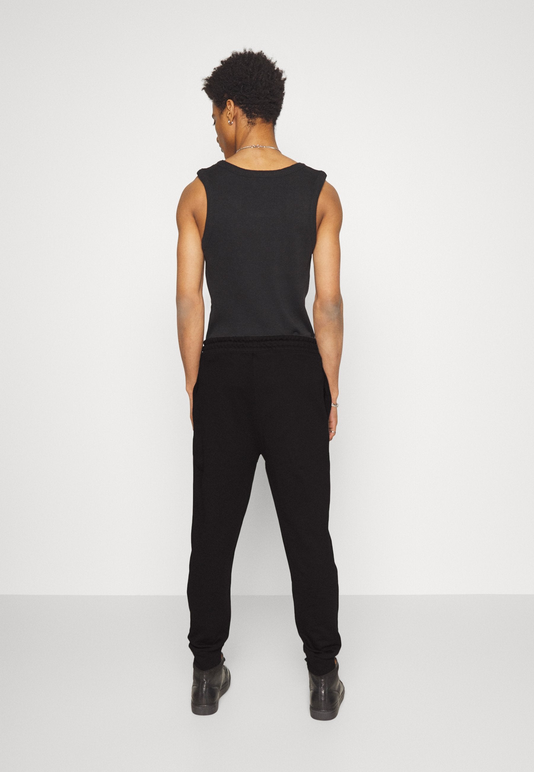 DUTSCHI - Tracksuit bottoms - black