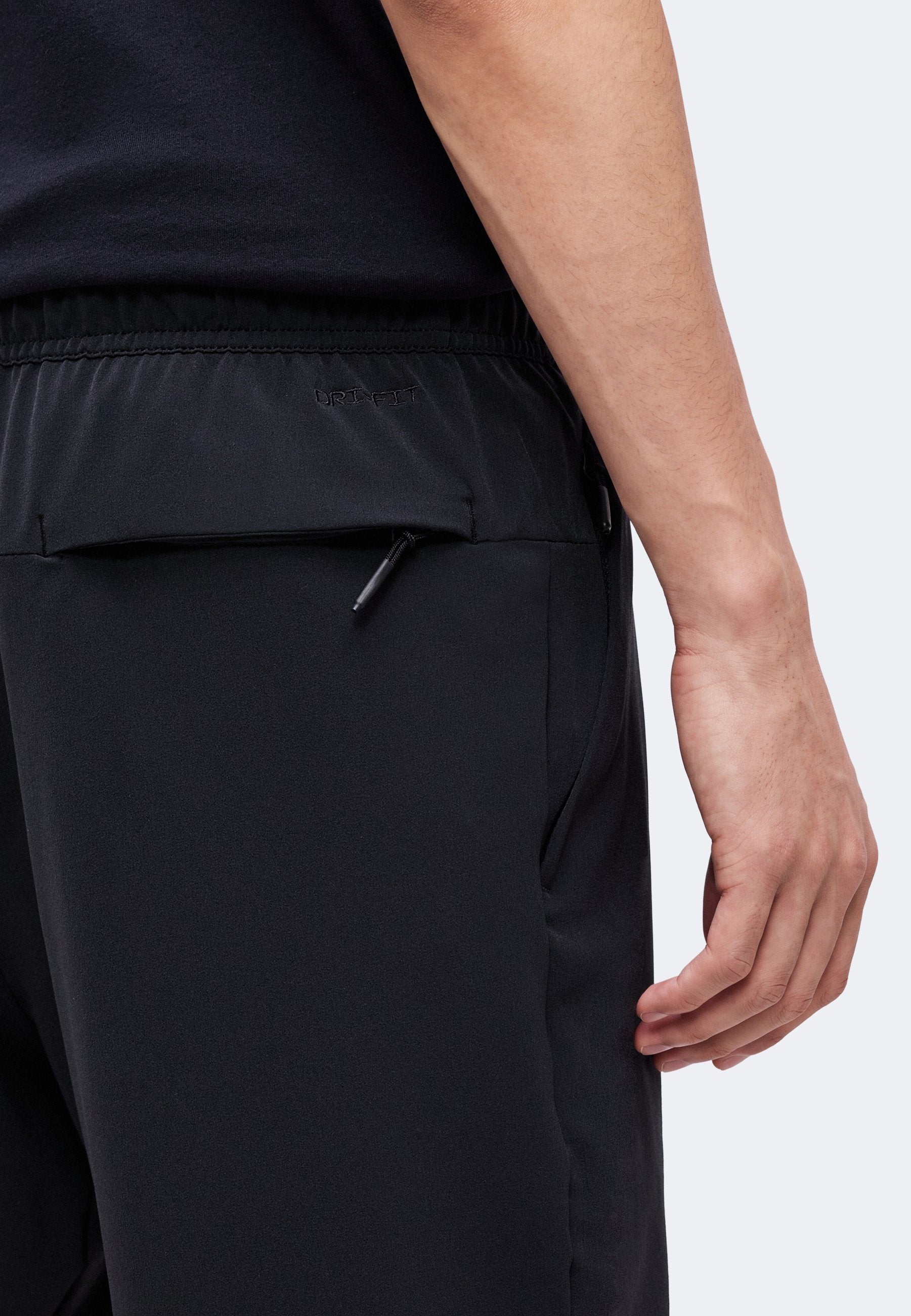 UNLIMITED - Tracksuit bottoms - black