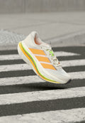 ADISTAR BYD 2 - Road running shoes - cloud white/lucid tangerine/signal green