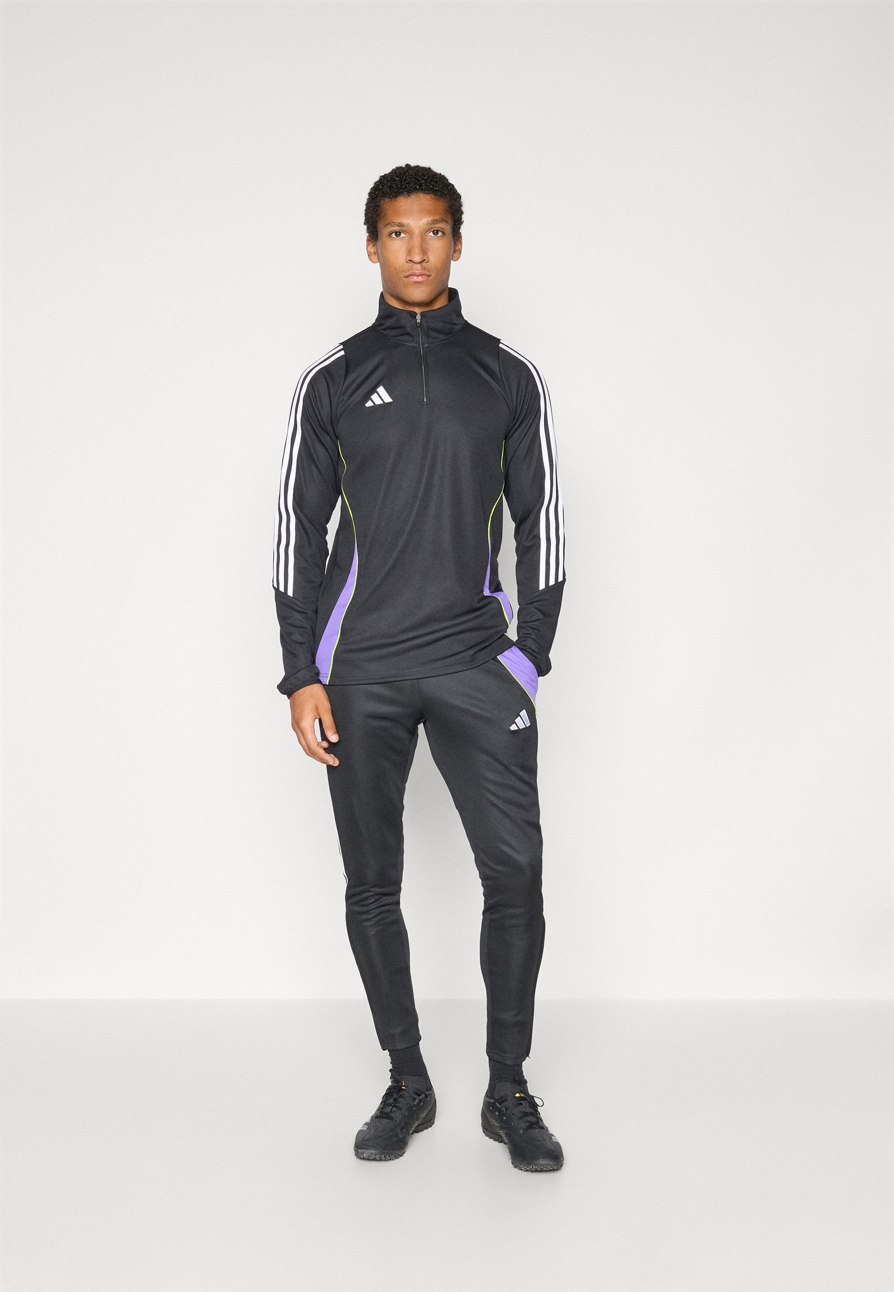 SQUADRA REGULAR FIT - Tracksuit bottoms - black/purple rush