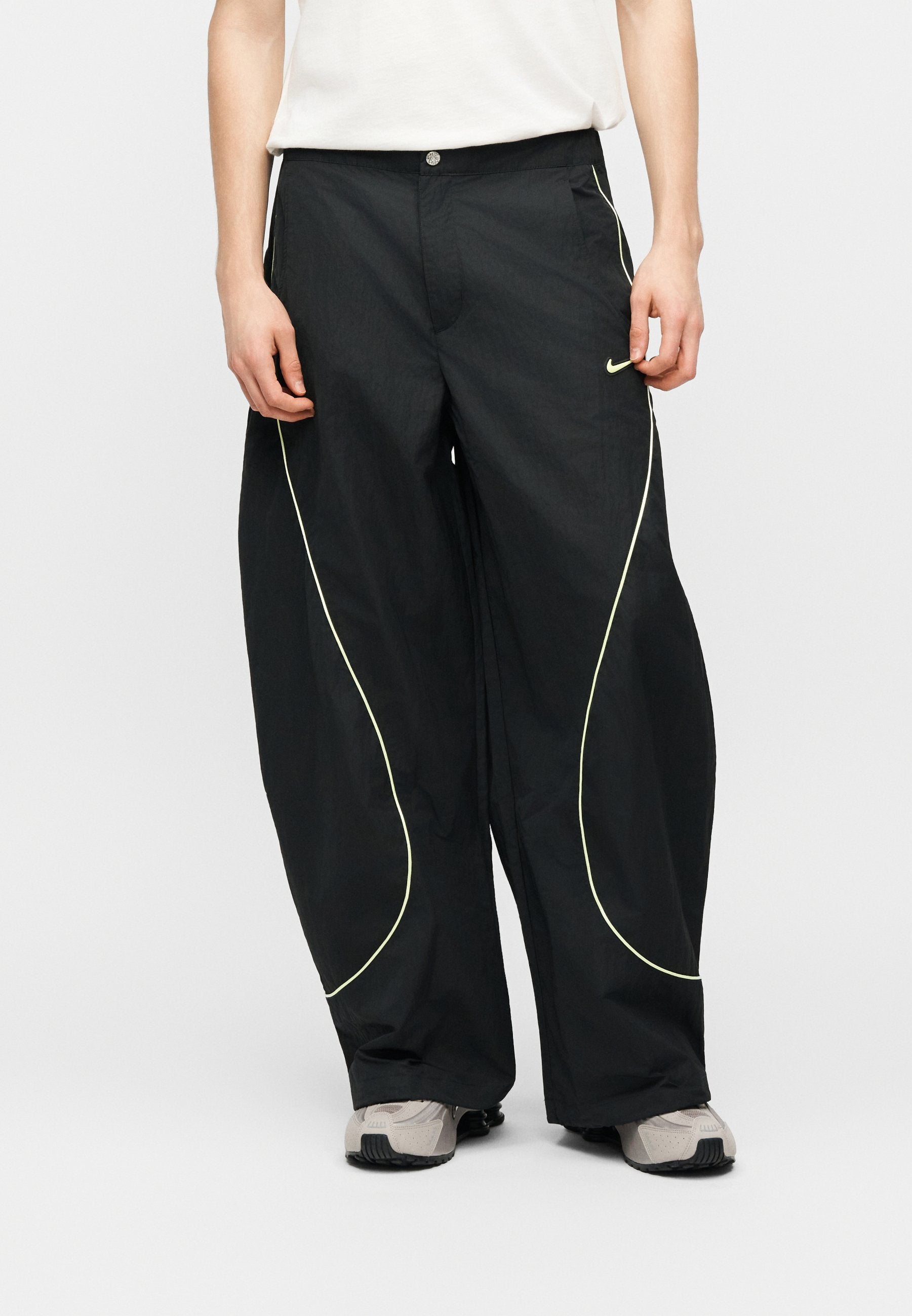 TOBI - Tracksuit bottoms - black/volt ice/cream
