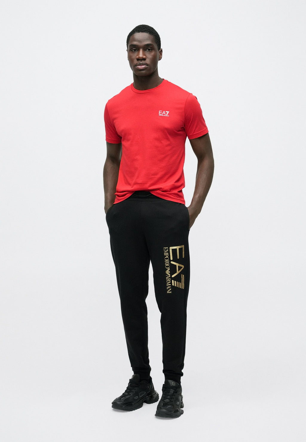 TRAIN CORE BIG LOGO PANTS - Tracksuit bottoms - black/gold-coloured