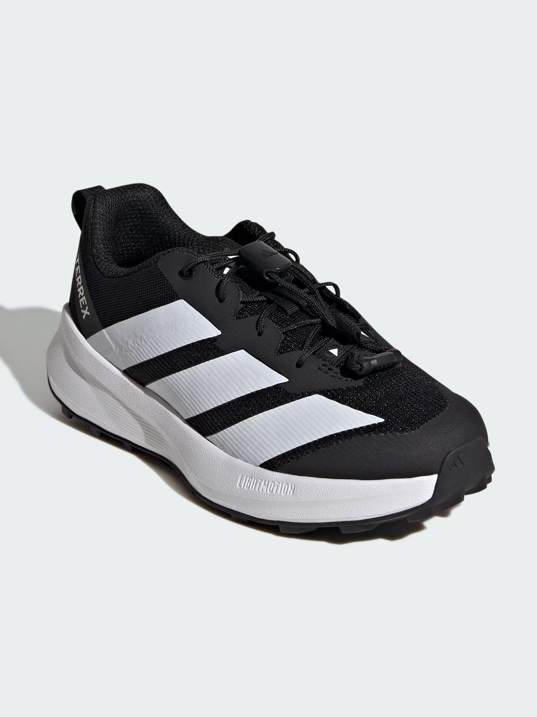 AGRAVIC UNISEX - Trail running shoes - core black/ftwr white/semi impact orange