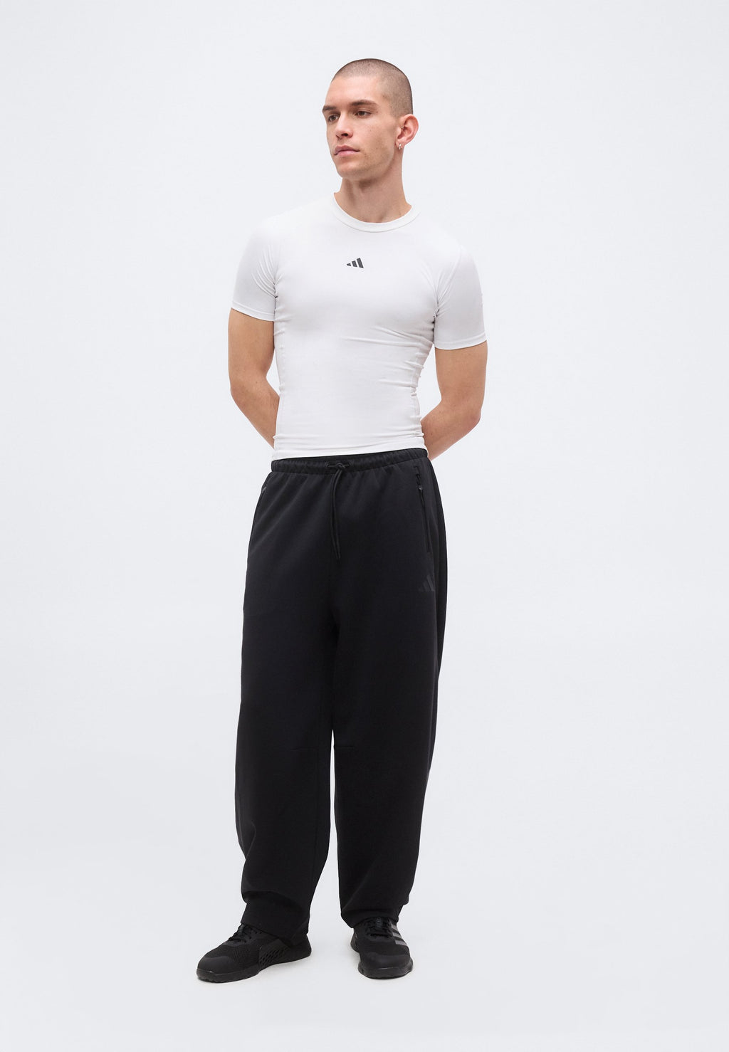 Z.N.E. OPEN HEM - Tracksuit bottoms - black