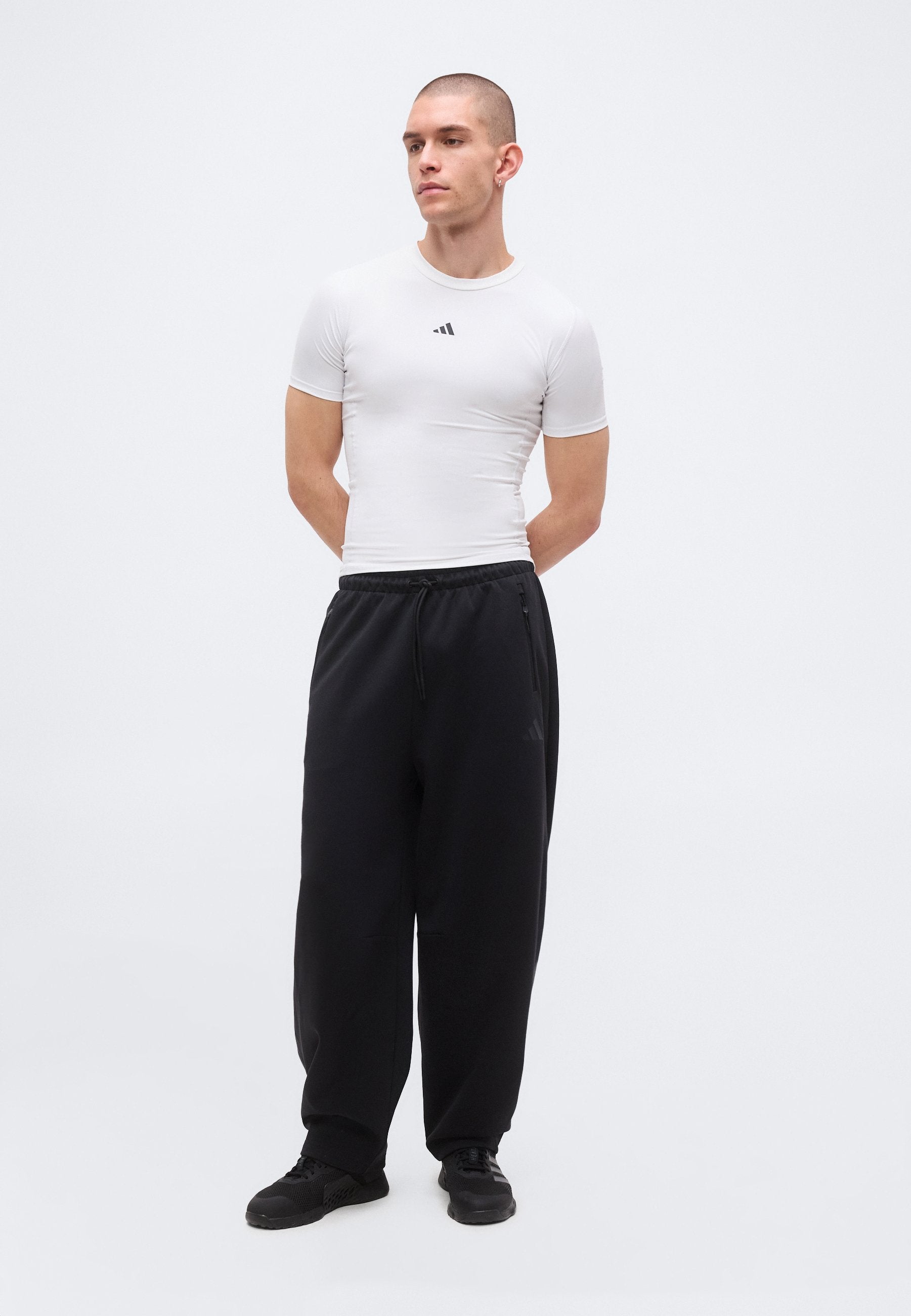 Z.N.E. OPEN HEM - Tracksuit bottoms - black