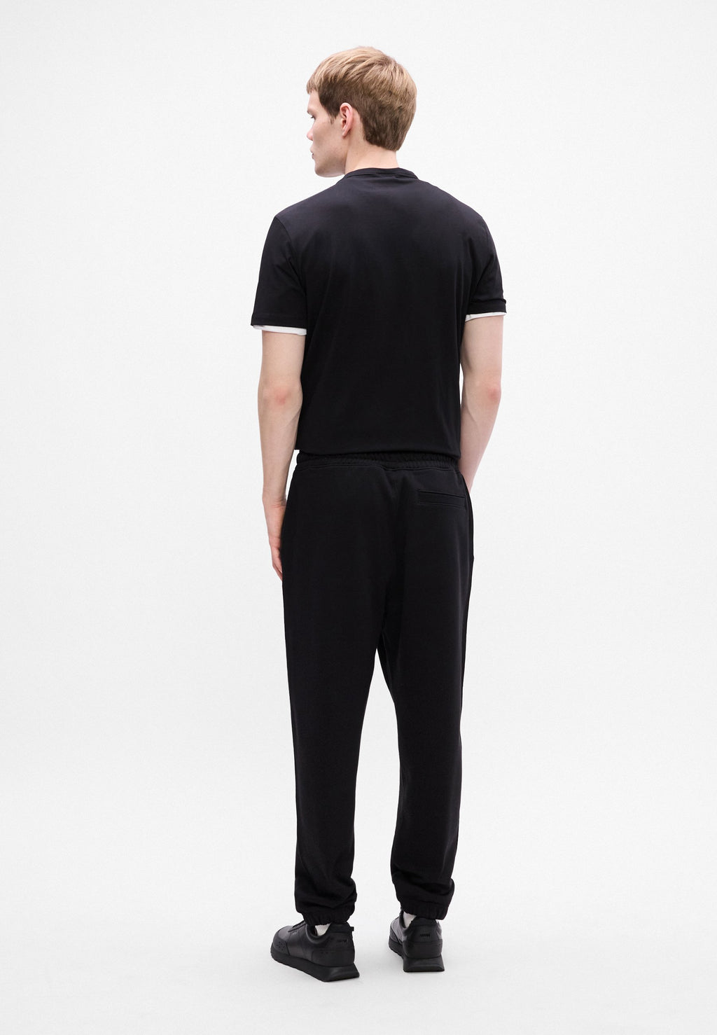 NYROTRO - Tracksuit bottoms - black