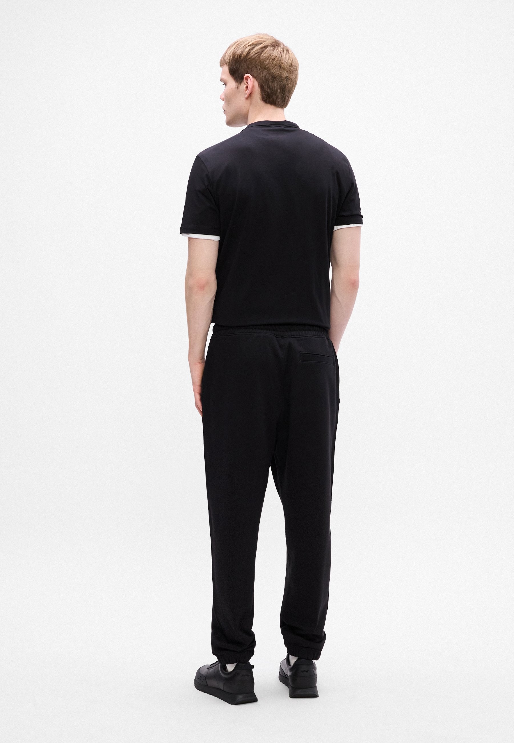 NYROTRO - Tracksuit bottoms - black