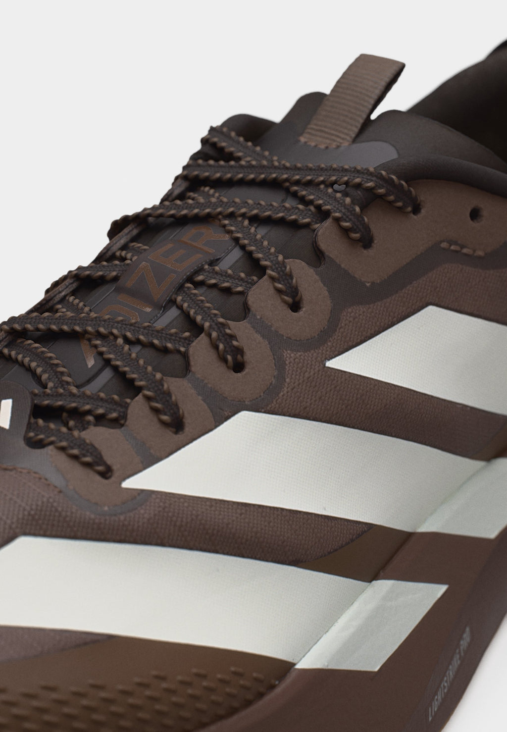 ADIZERO EVO SL ATR M - Trainers - earth strata/off white/warm sandstone