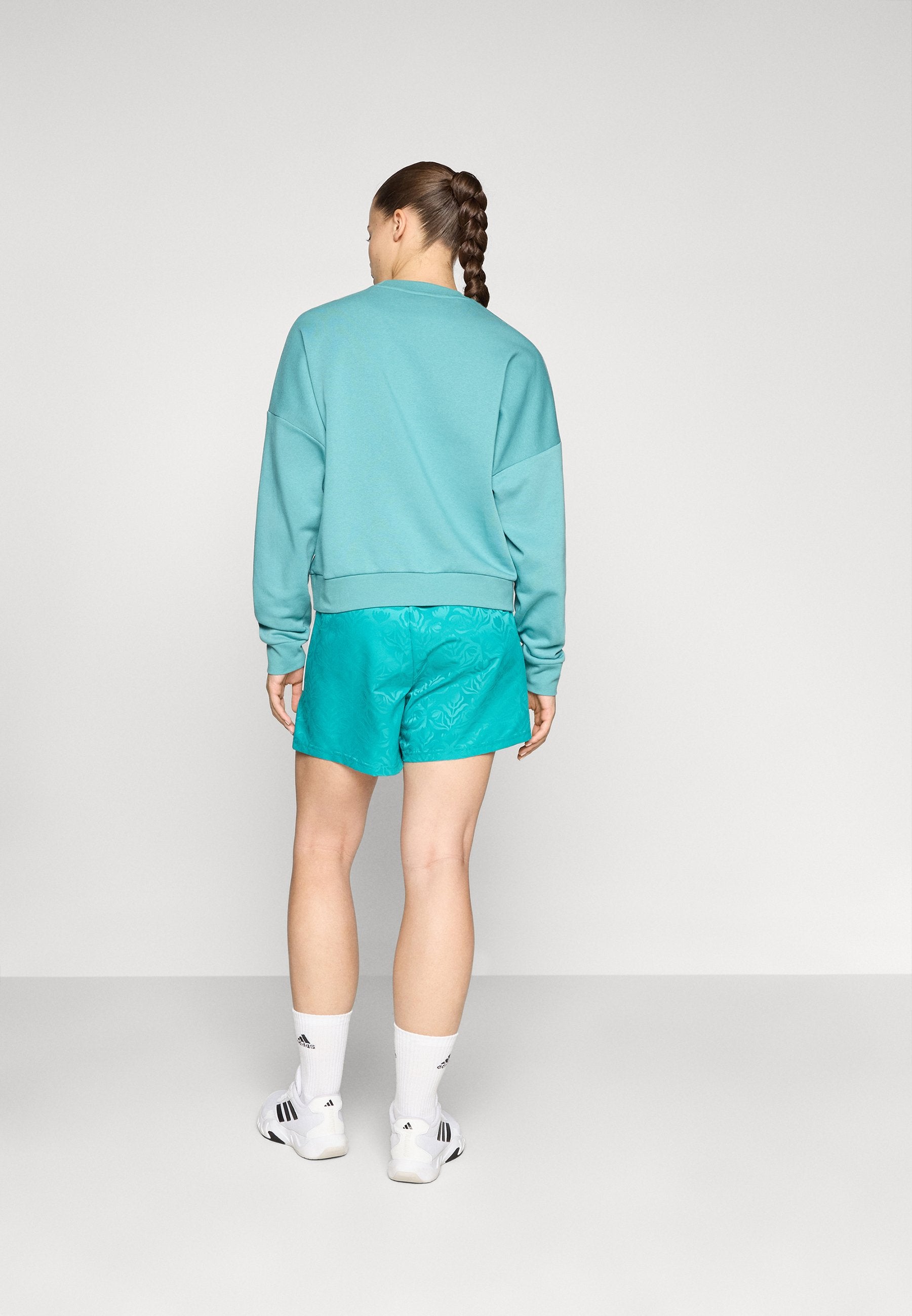 TIRO  - Sports shorts - pure teal/white