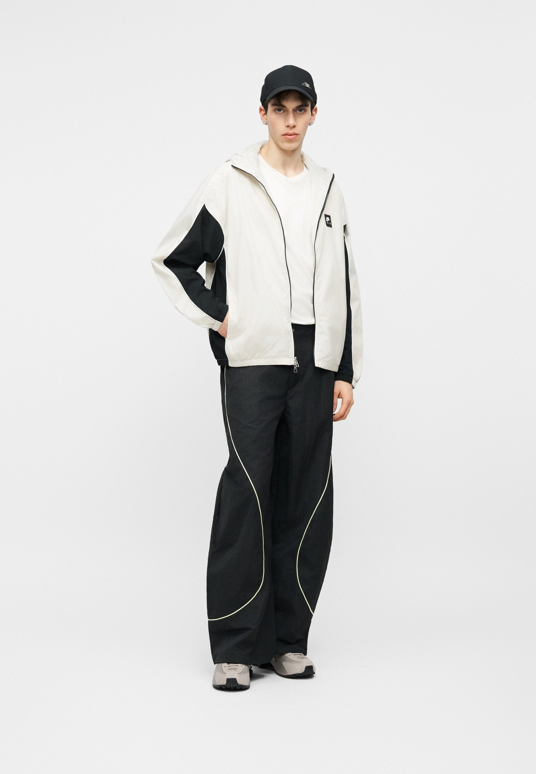 TOBI - Tracksuit bottoms - black/volt ice/cream