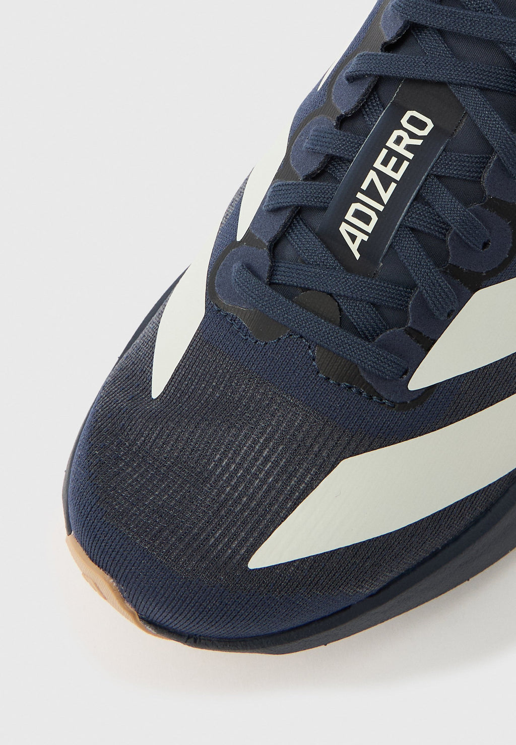 ADIZERO EVO SL J UNISEX - Road running shoes - shadow navy/white/warm sandstone