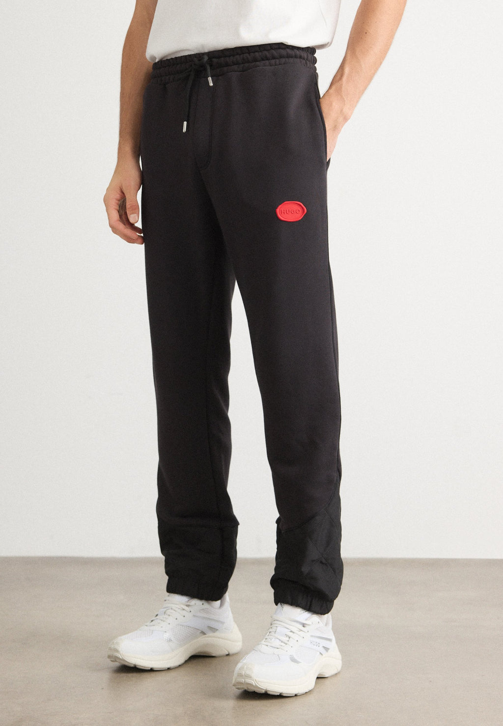 DILVANOS - Tracksuit bottoms - black