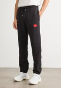 DILVANOS - Tracksuit bottoms - black