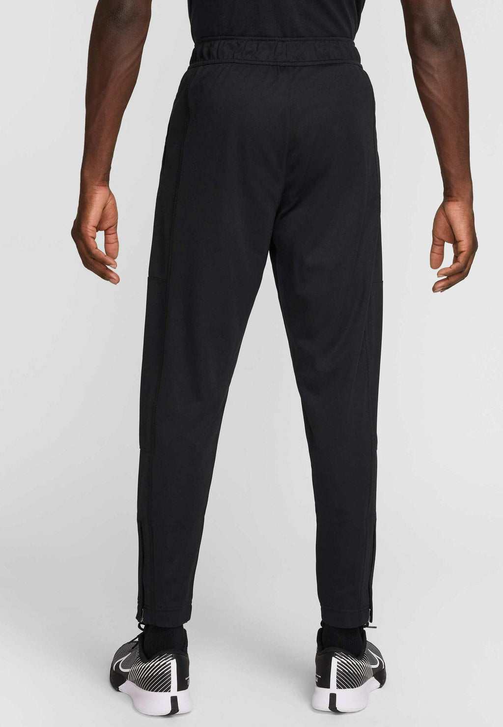 HERITAGE - Tracksuit bottoms - black black