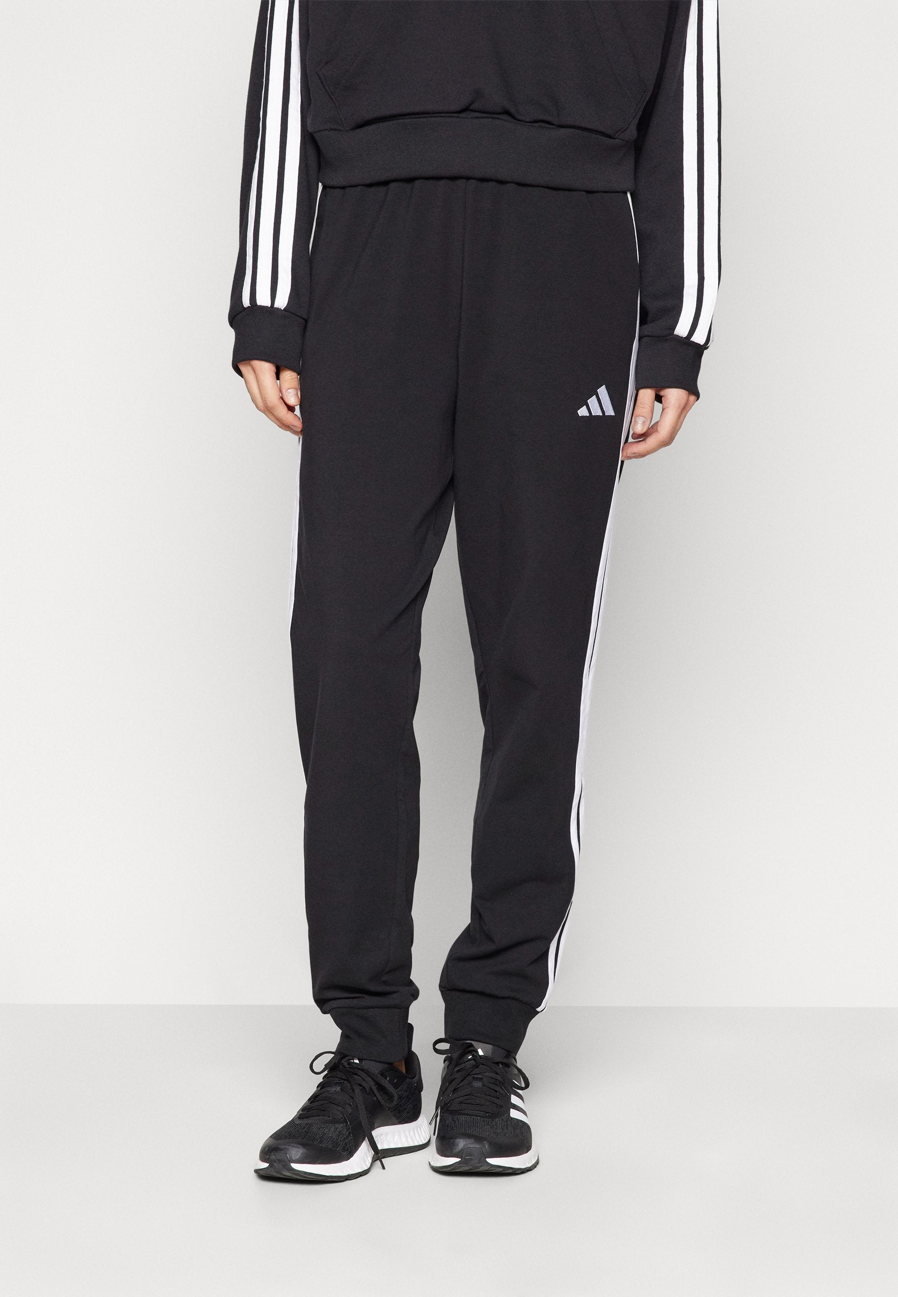 JOGGER - Tracksuit bottoms - black/white