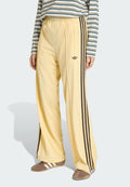 LOOSE - Tracksuit bottoms - orange tint