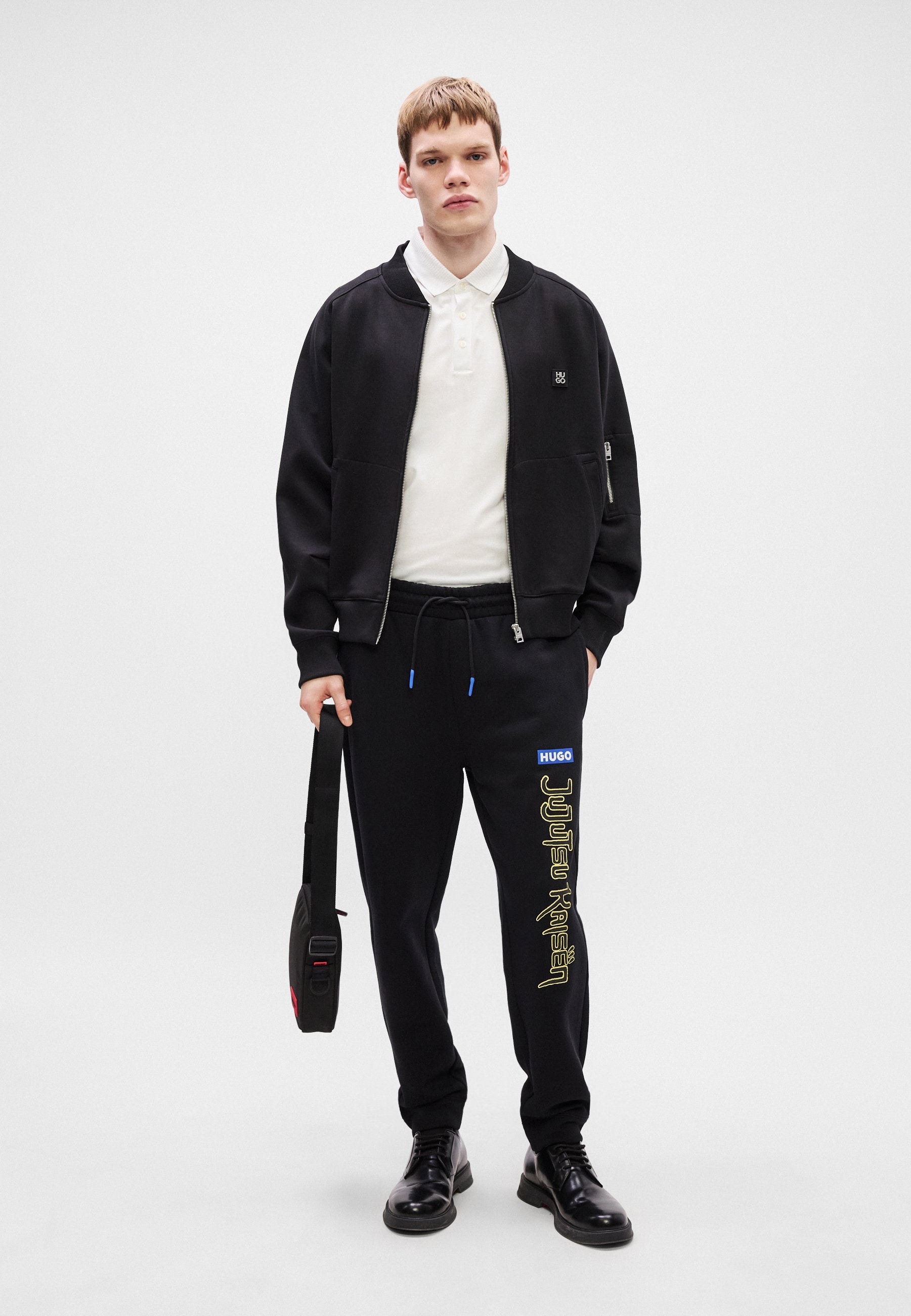 X JUJUTSU KAISEN NIMAYTRO - Tracksuit bottoms - black