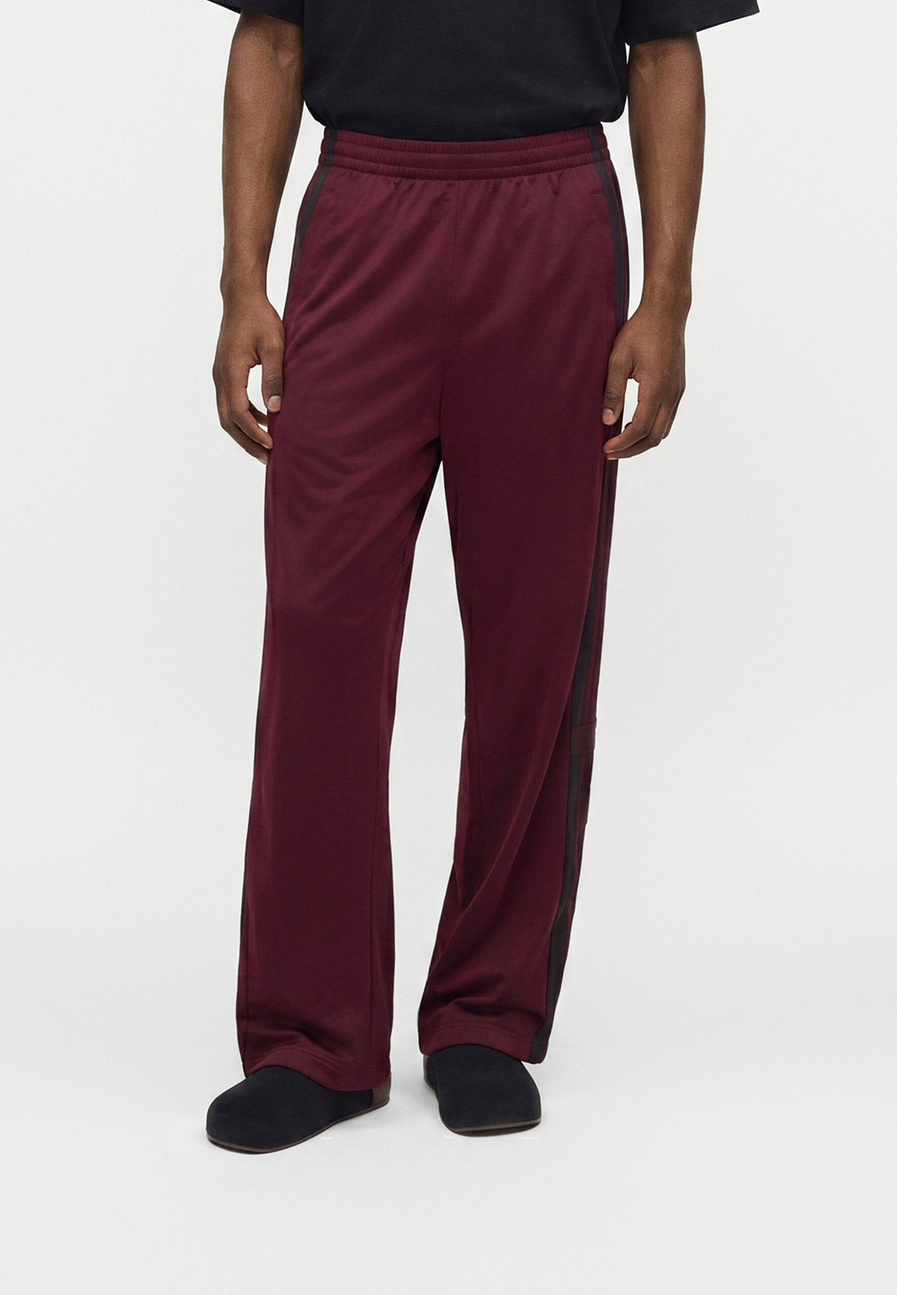 ADIBREAK UNISEX - Tracksuit bottoms - maroon