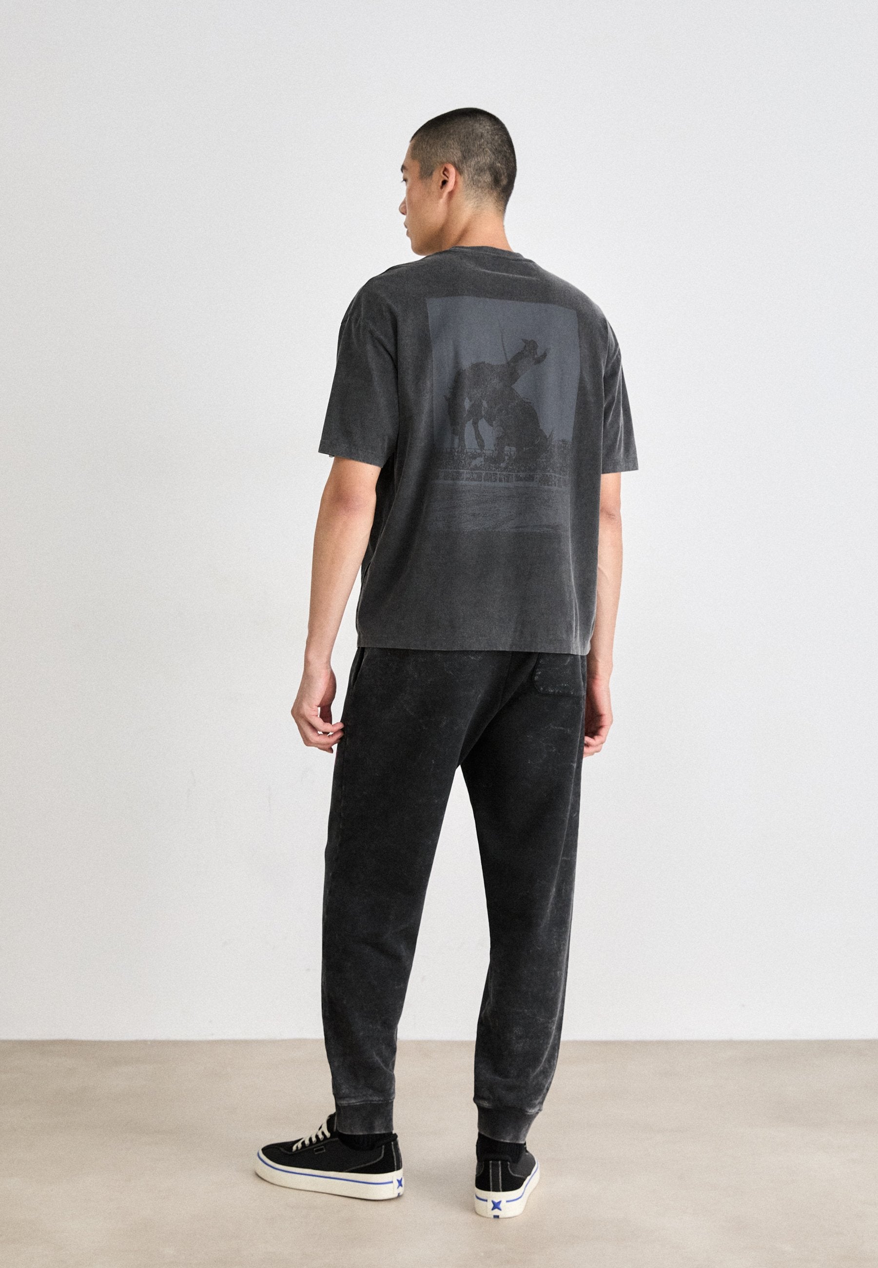 NEVEZ  - Tracksuit bottoms - black