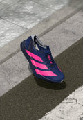 ADIZERO ADIOS PRO 4 - Road running shoes - dark blue/shock pink/dash grey