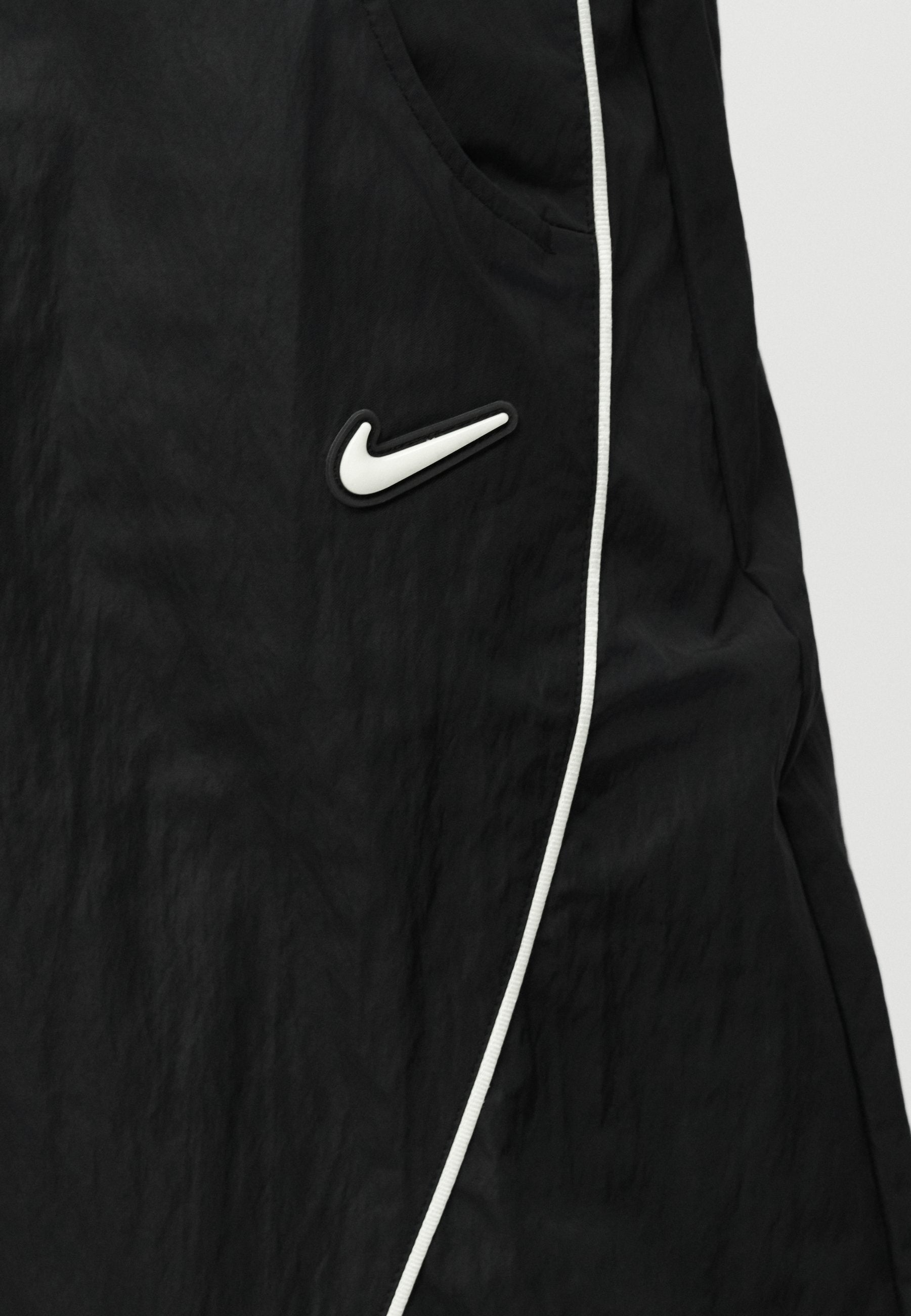 TOBI - Tracksuit bottoms - black/volt ice/cream