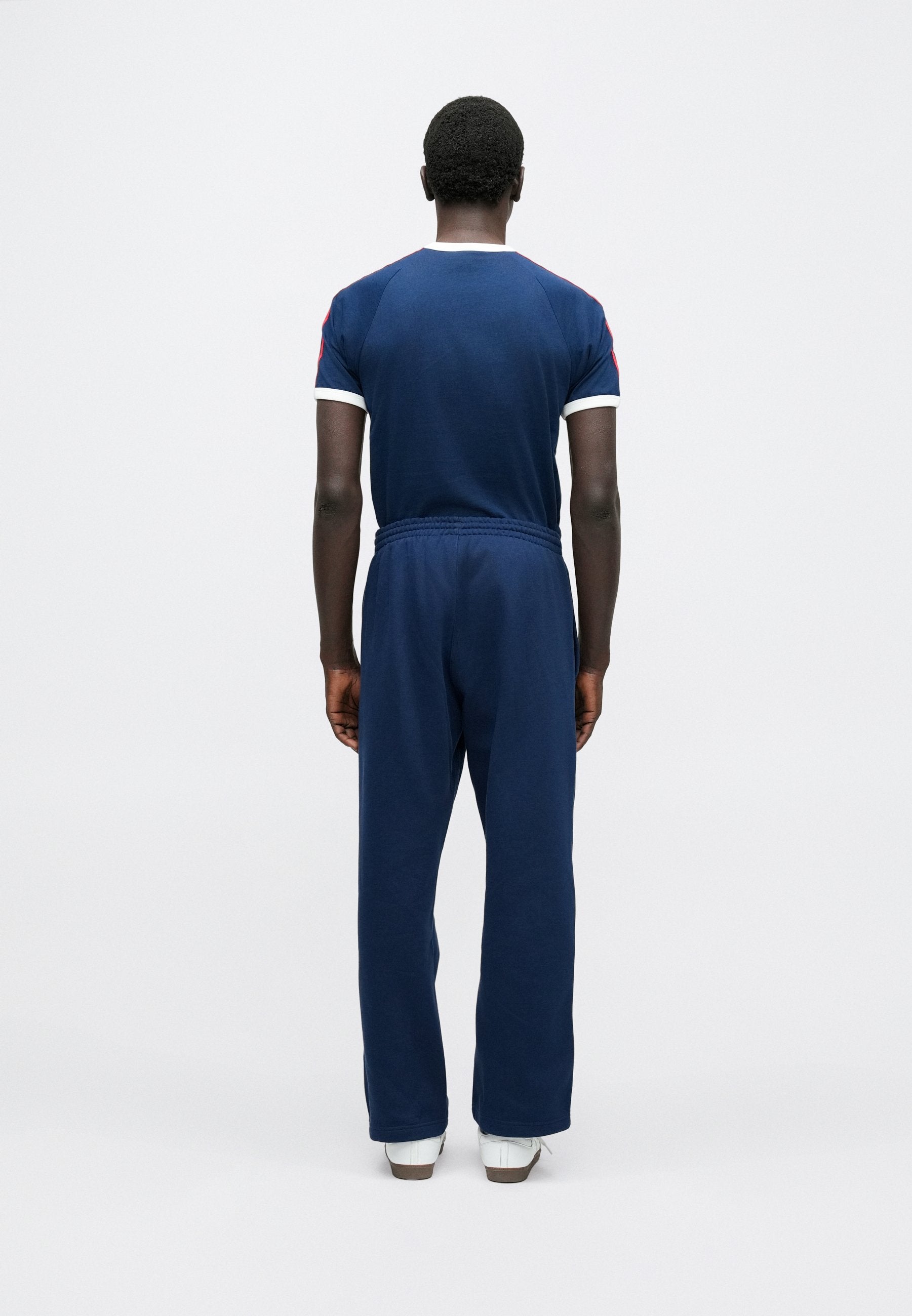 LOOSE UNISEX - Tracksuit bottoms - night indigo