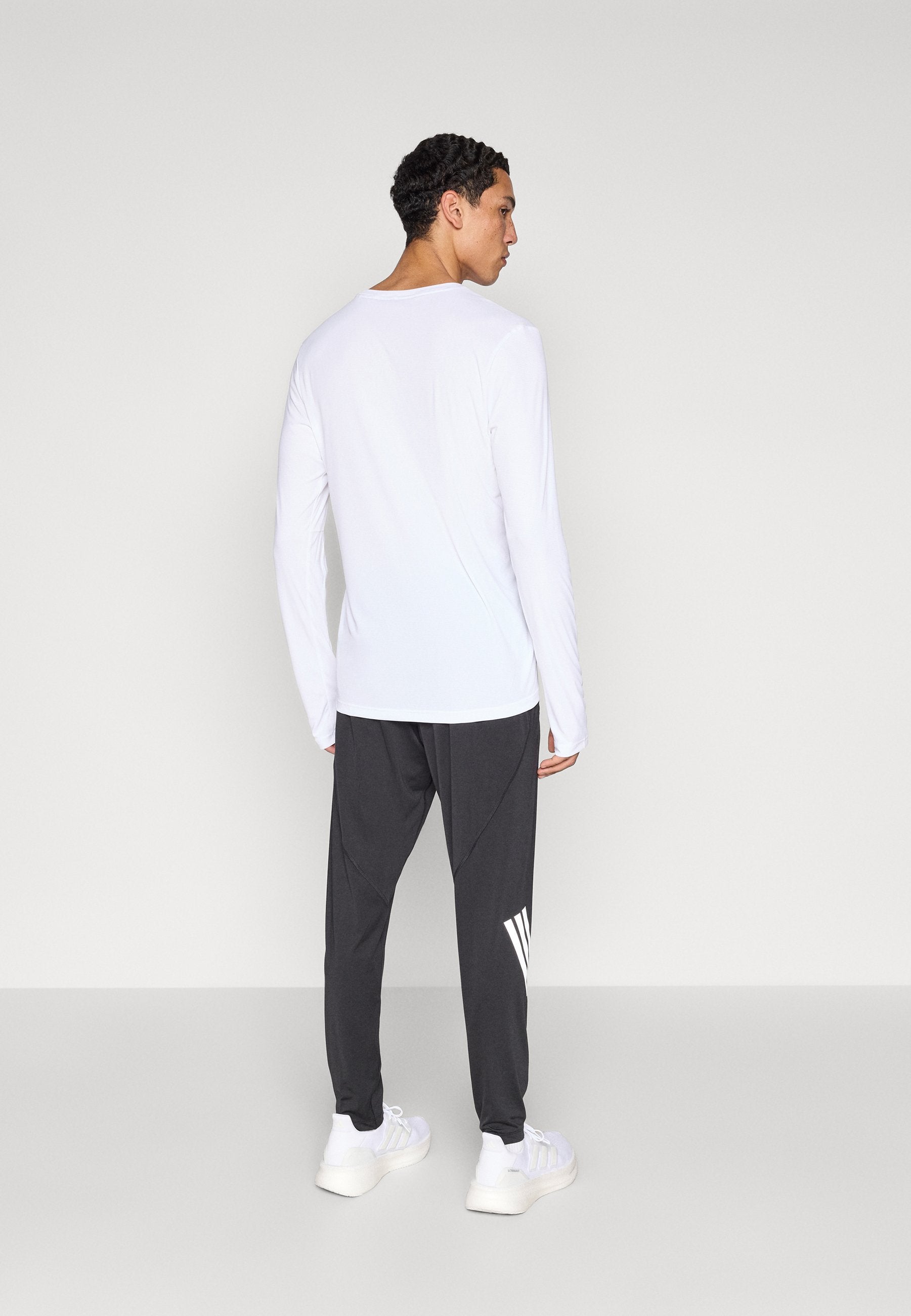 ADI365 - Tracksuit bottoms - black