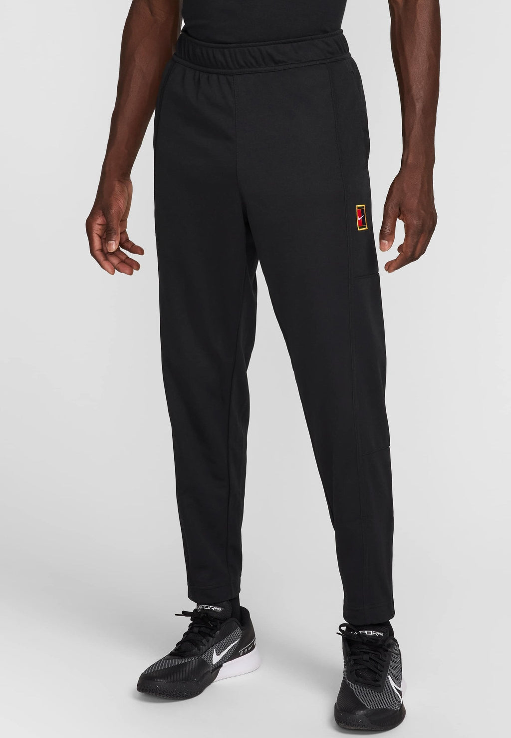 HERITAGE - Tracksuit bottoms - black black