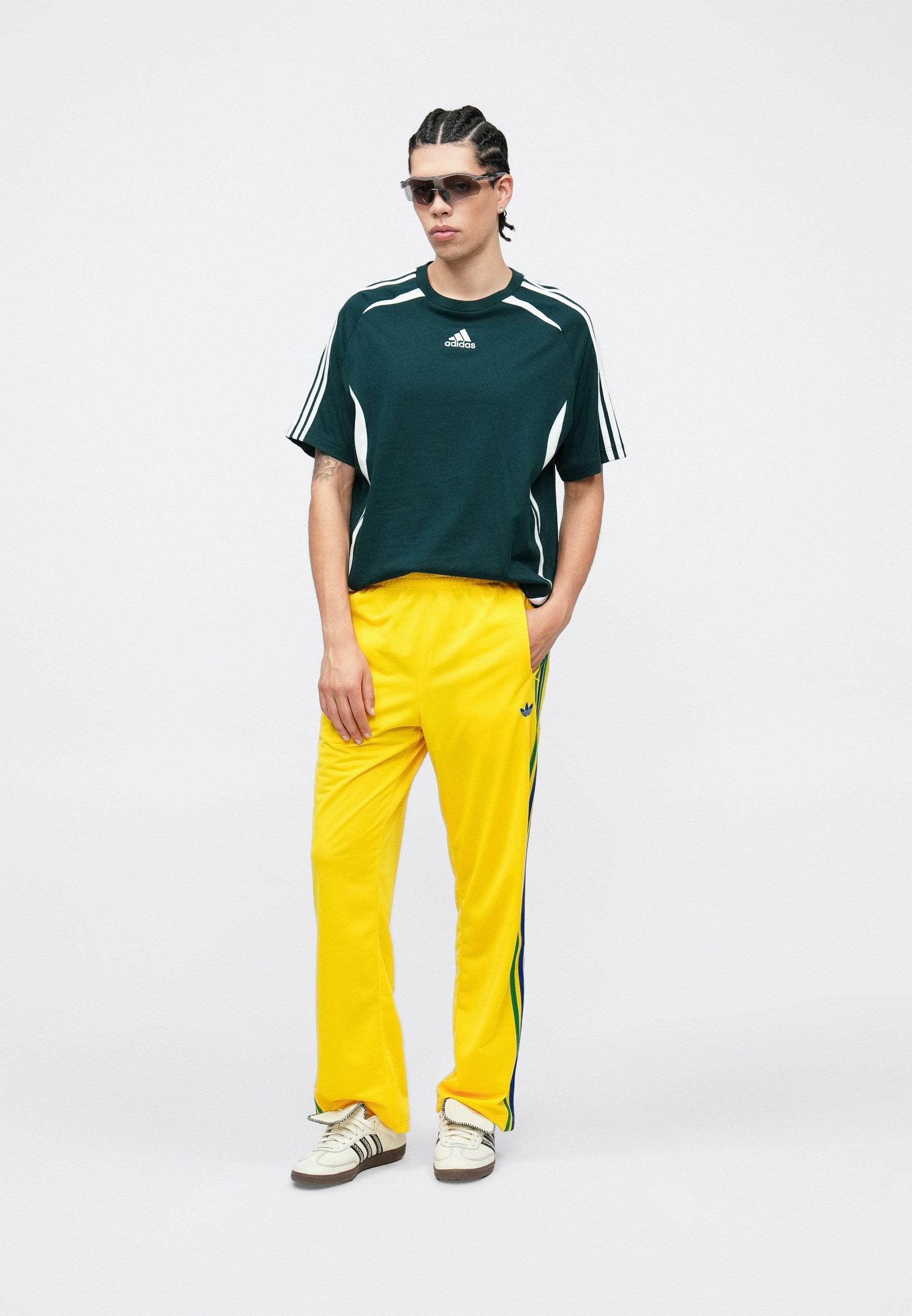 FIREBIRD TP - Tracksuit bottoms - yellow