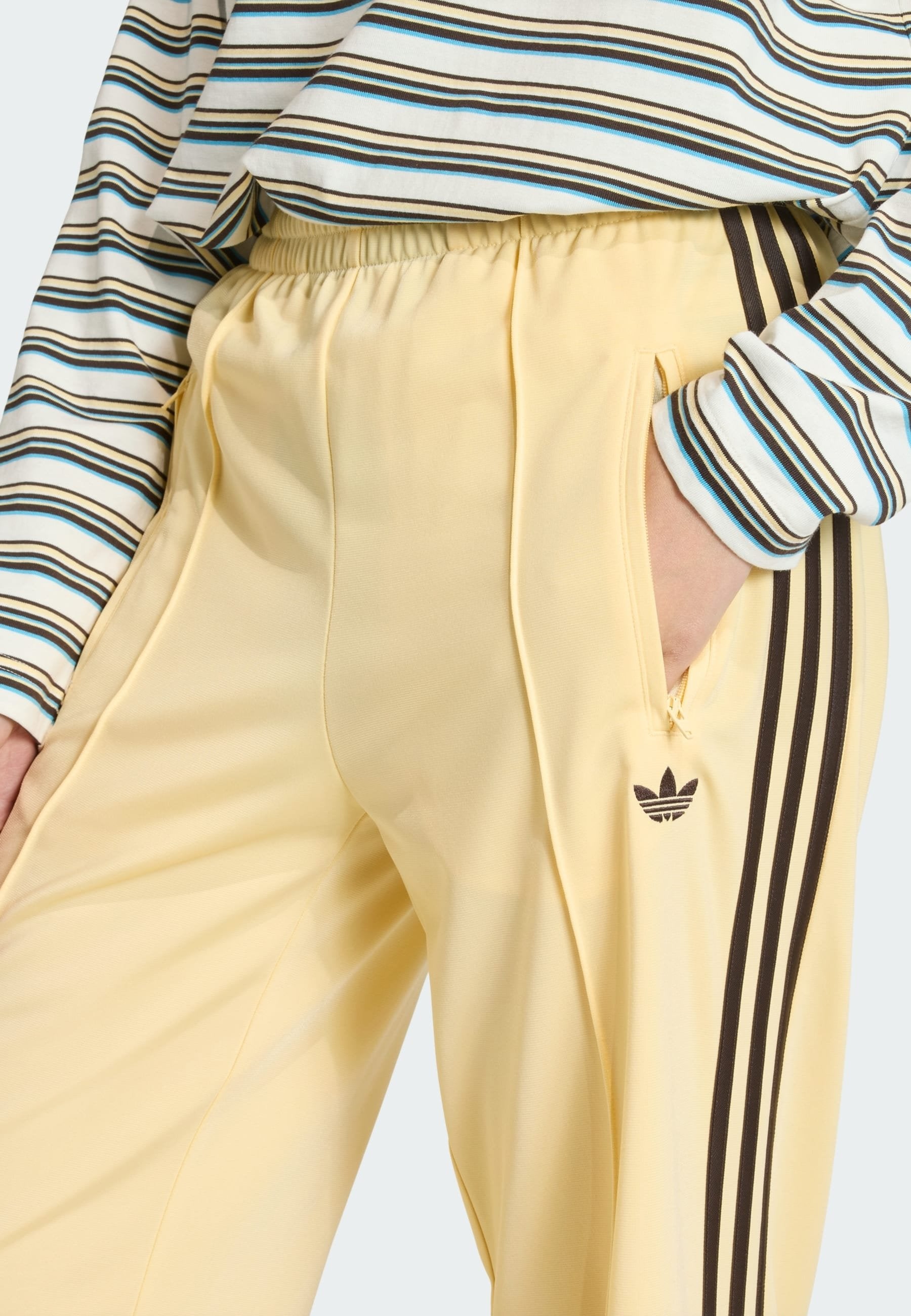 LOOSE - Tracksuit bottoms - orange tint