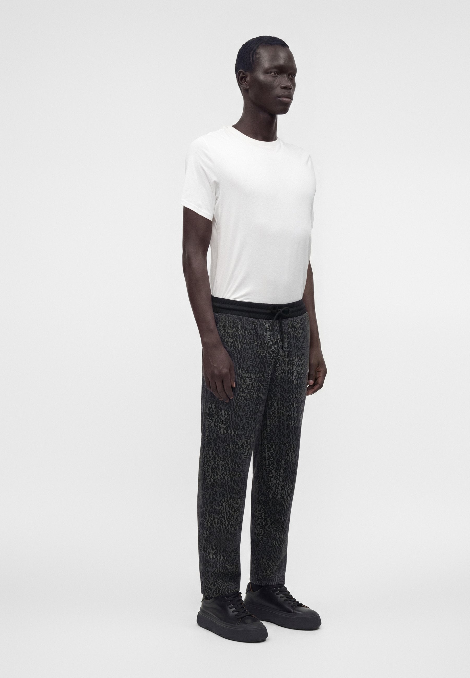 TRAIN LOGO SERIES MONOGRAM - Tracksuit bottoms - black