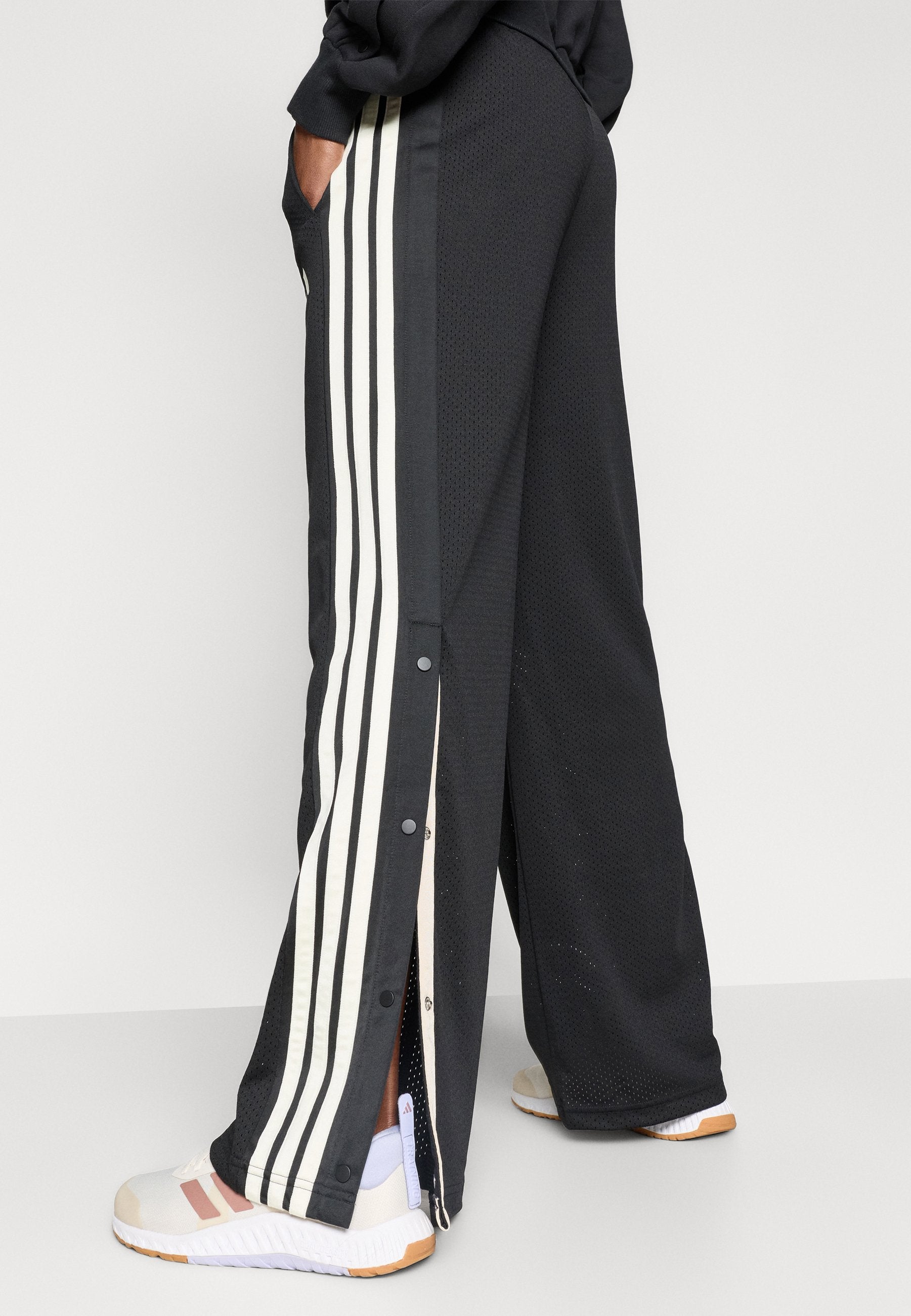 STADIUM MESH - Tracksuit bottoms - black/off white/crystal linen