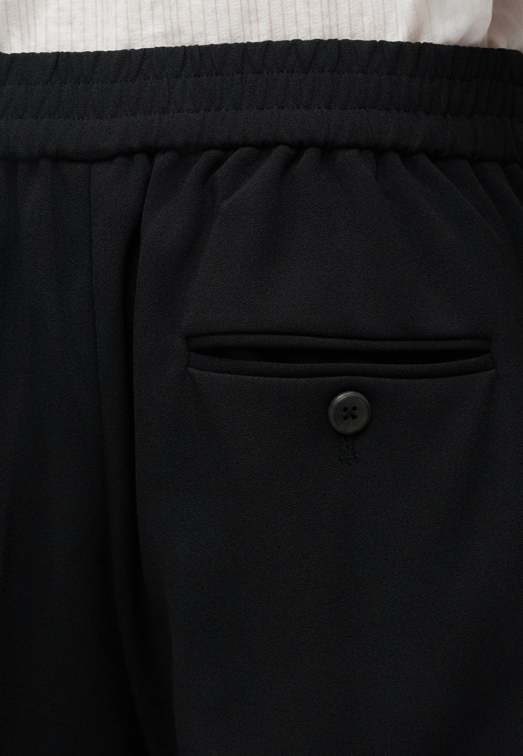 TRAVEL PANT - Trousers - black