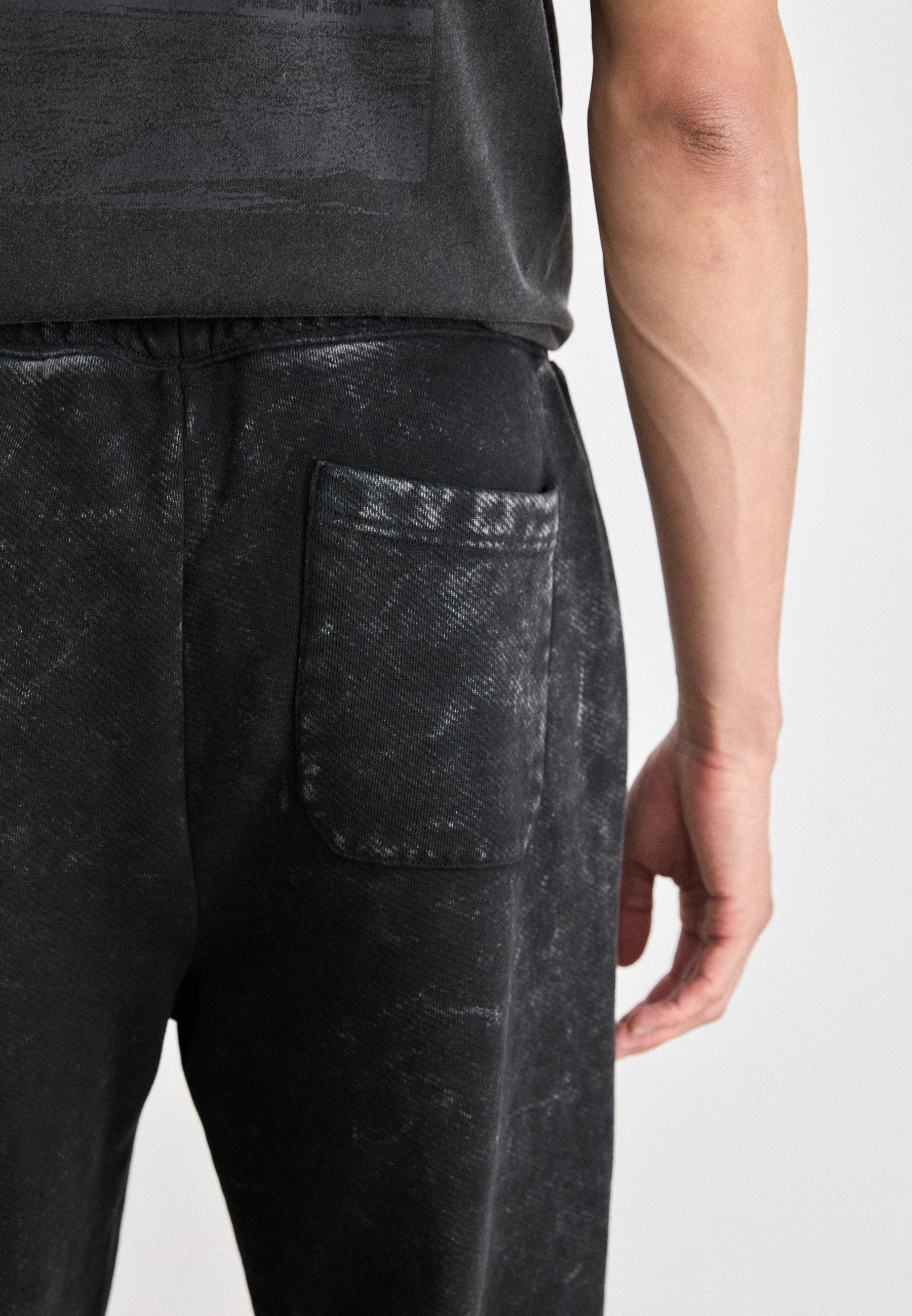 NEVEZ  - Tracksuit bottoms - black