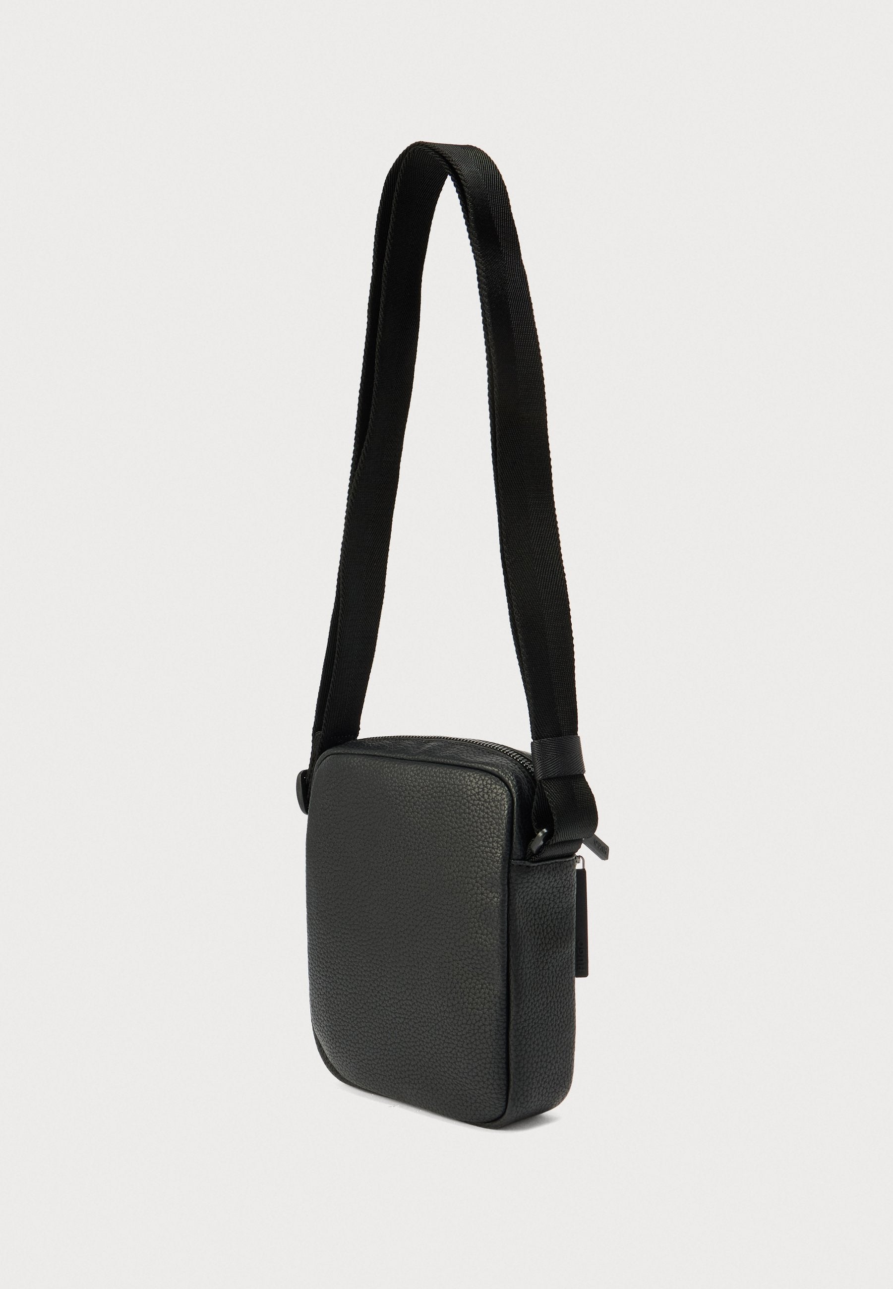 ETHON UNISEX - Cross body bag - black