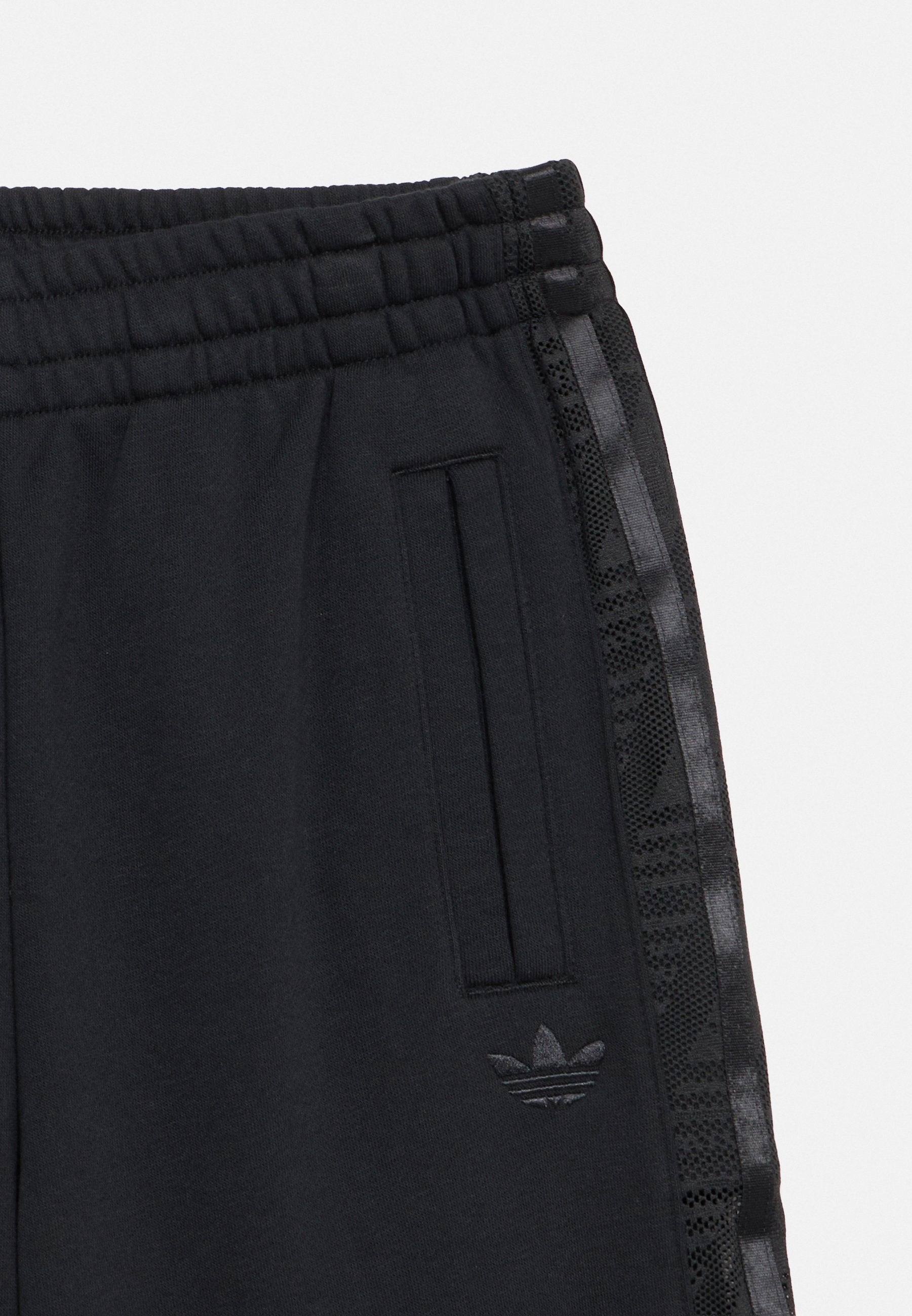 LOOSE - Tracksuit bottoms - black