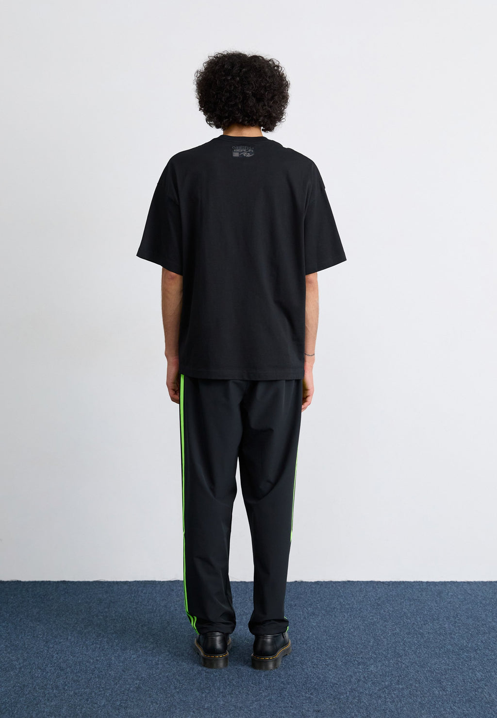 DRILL - Tracksuit bottoms - black/signal green