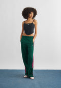 PANTALON DE SURVÊTEMENT FIREBIRD LOOSE - Bas de survêtement - vert université/magenta vif