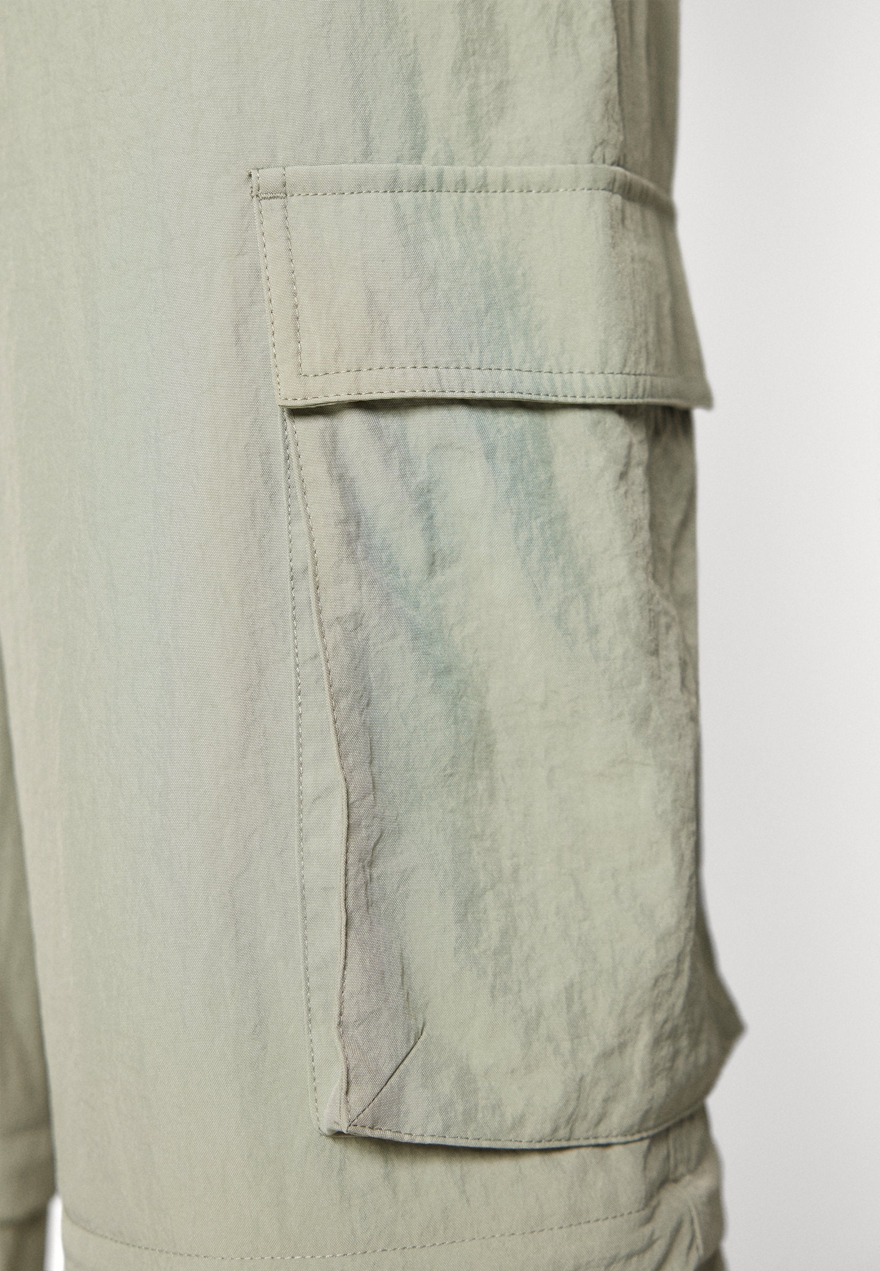 CLAIRE ZIP-OFF - Cargo trousers - faded willow