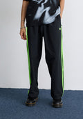 DRILL - Tracksuit bottoms - black/signal green