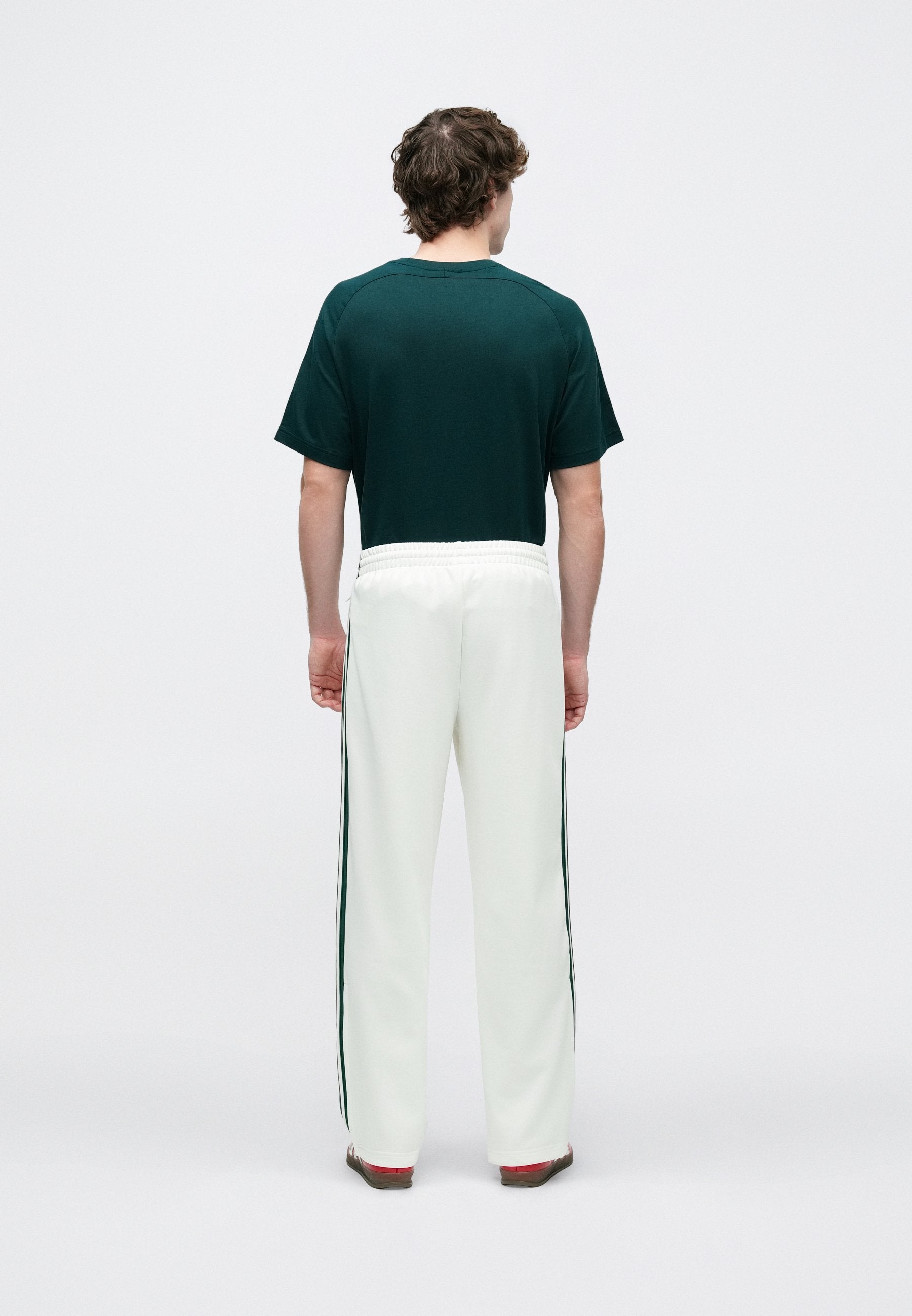 TRACK PANT - Tracksuit bottoms - off white/collegiate green