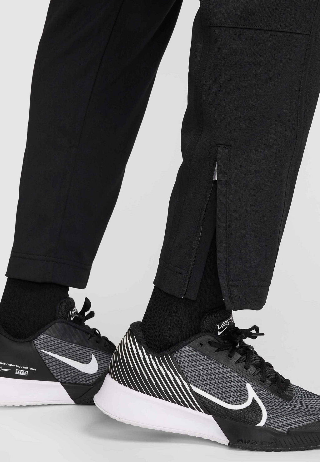 HERITAGE - Tracksuit bottoms - black black