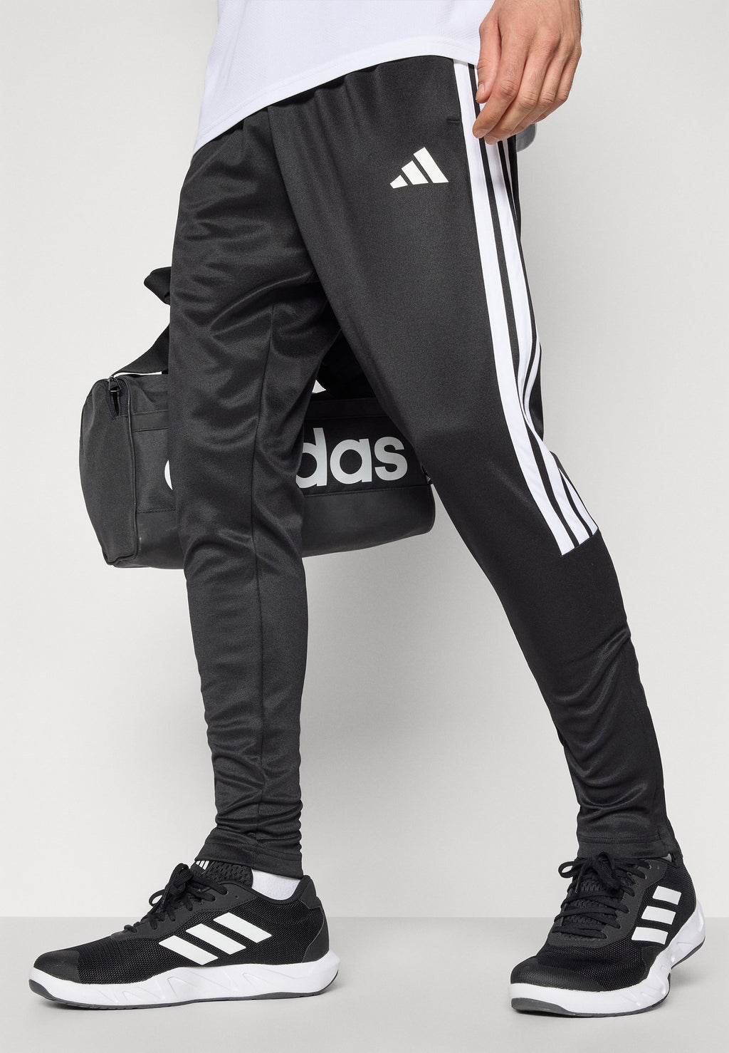 TIRO - Tracksuit bottoms - black/white