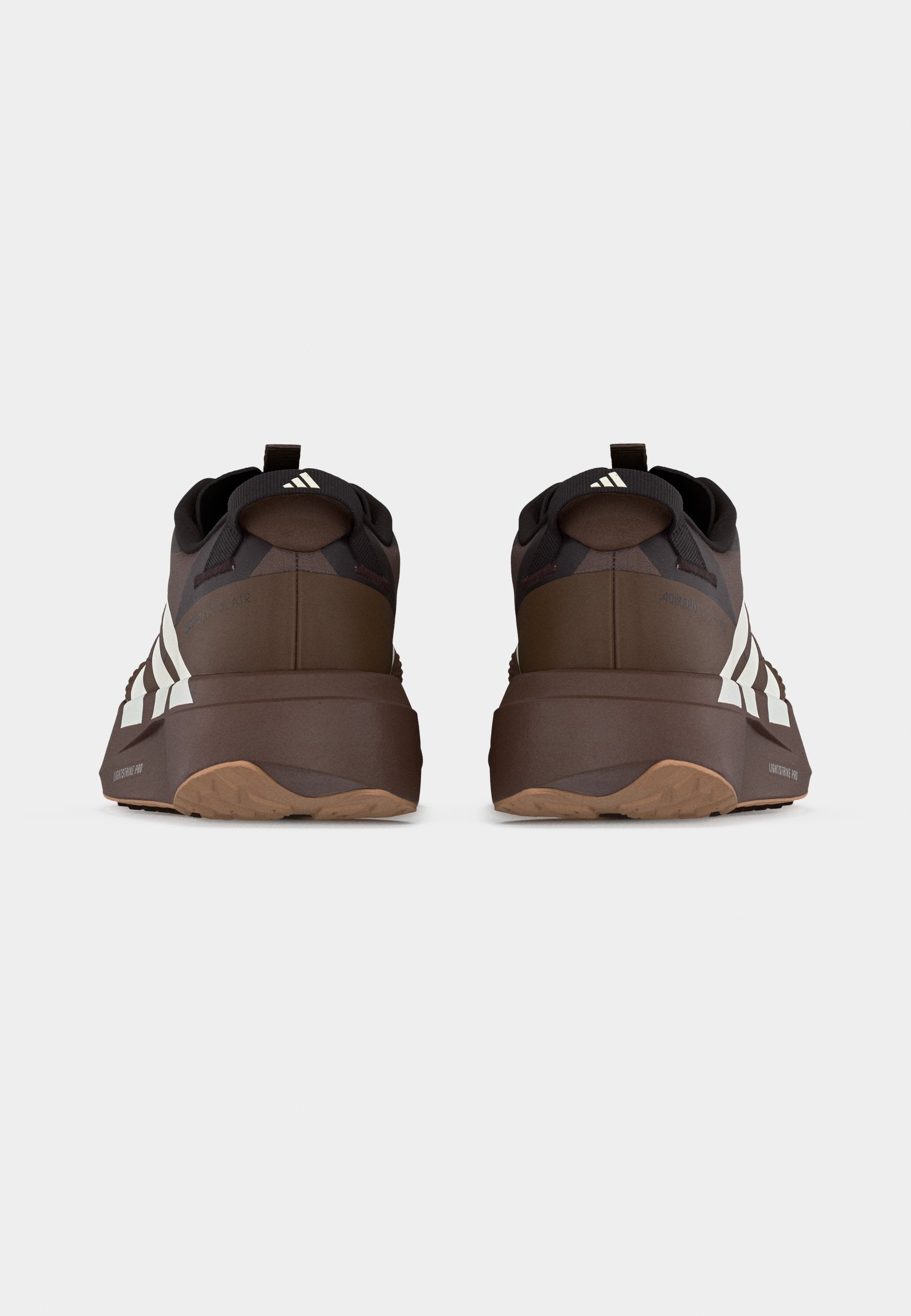 ADIZERO EVO SL ATR M - Trainers - earth strata/off white/warm sandstone