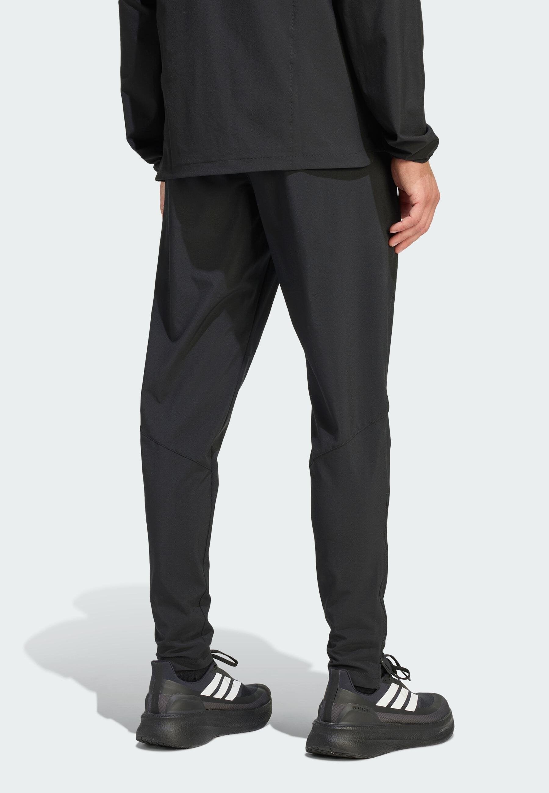 TIRO TRAVEL  - Tracksuit bottoms - black   black