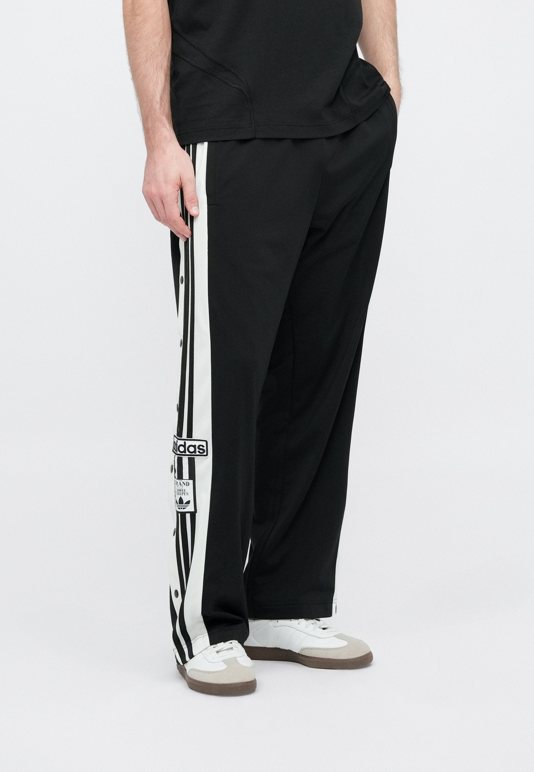 ADIBREAK UNISEX - Tracksuit bottoms - black/white