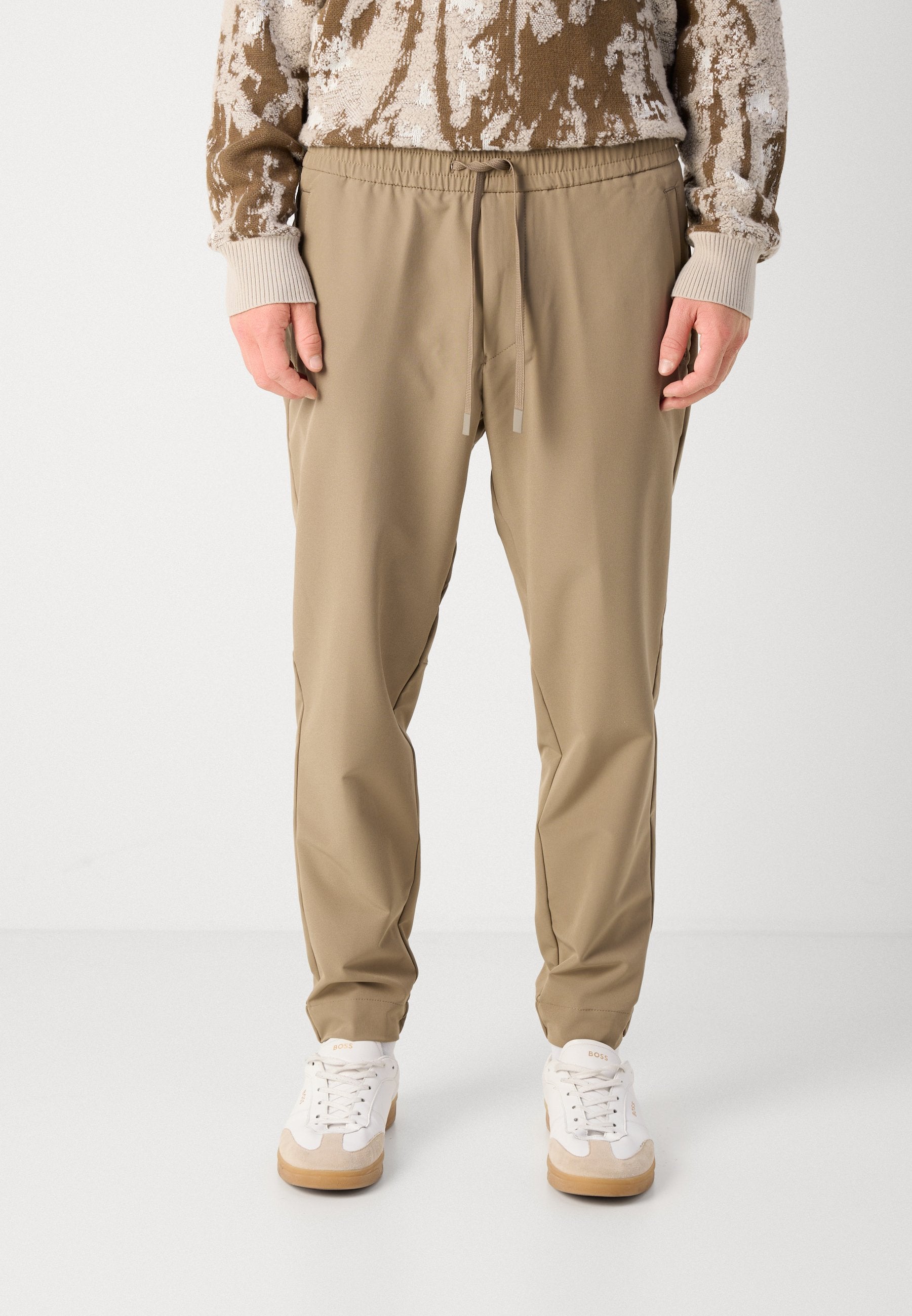 T_FLEX - Trousers - light/pastel green