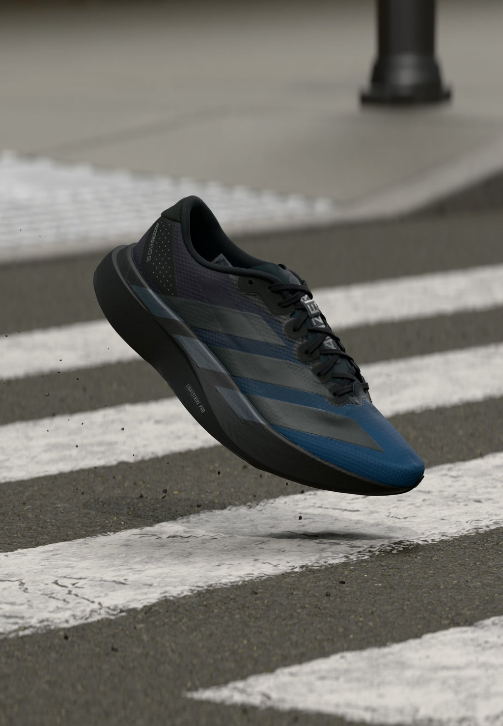ADIZERO EVO SL WOVEN M - Trainers - black/dark blue