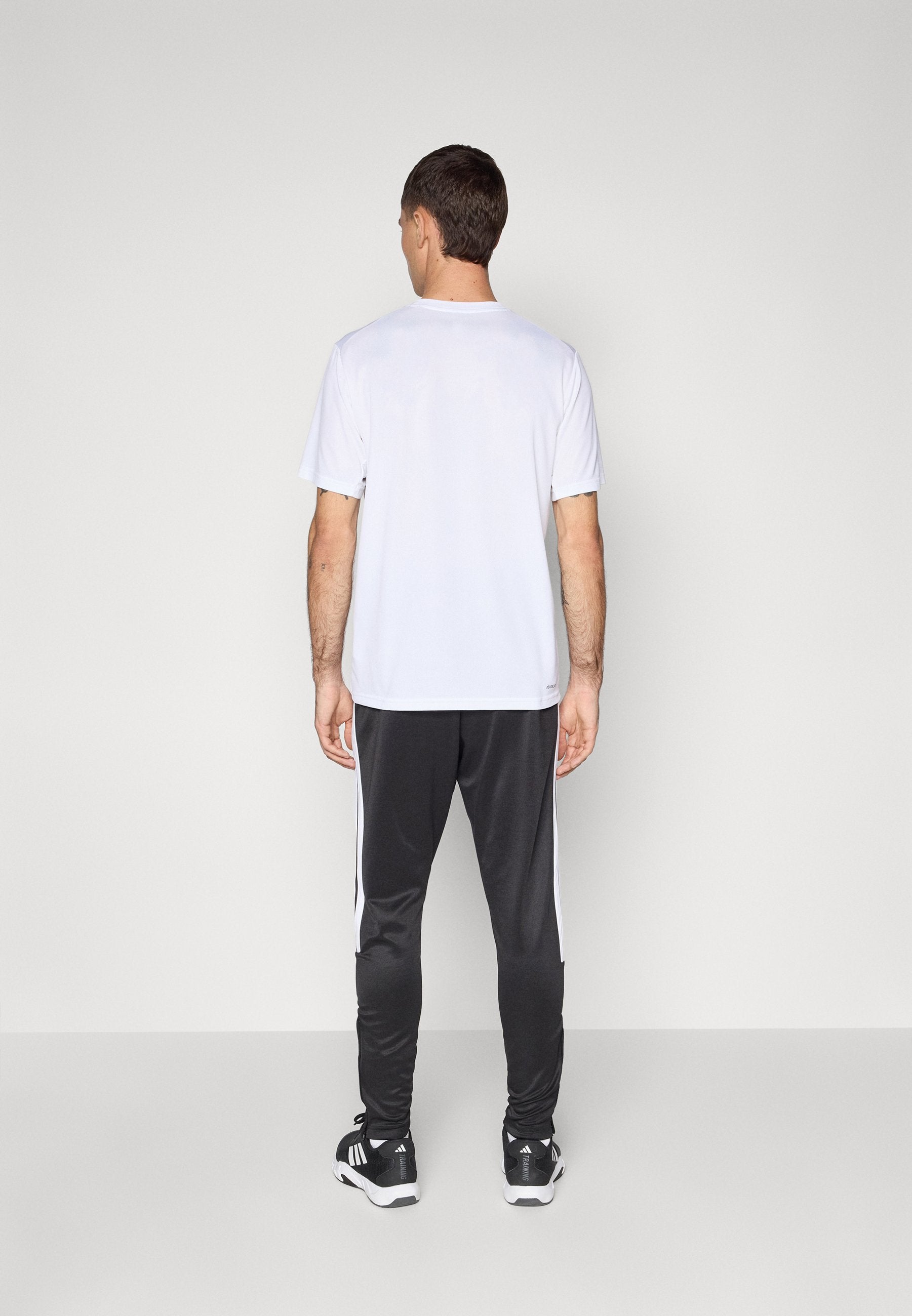 TIRO - Tracksuit bottoms - black/white